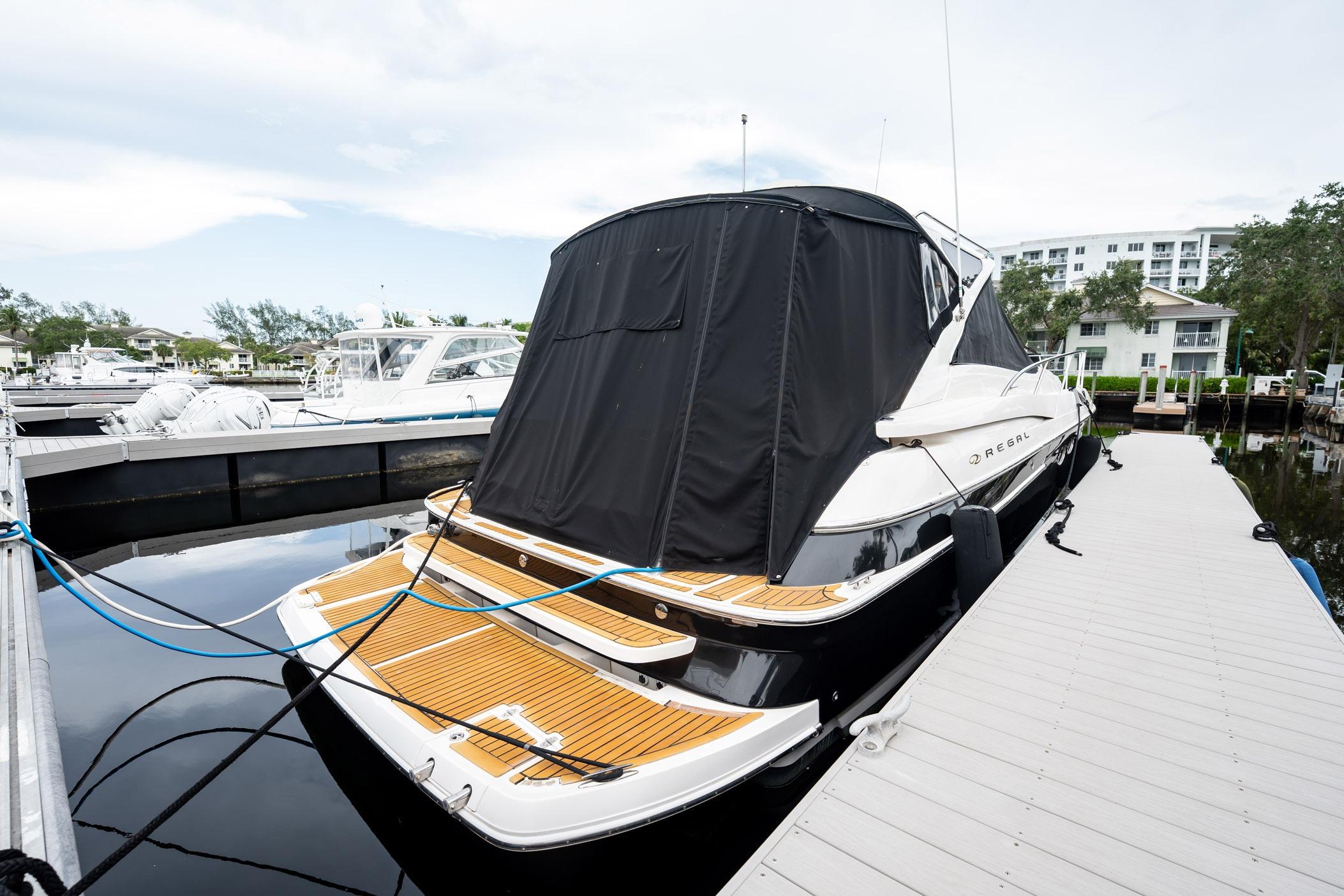 2008 Regal Commodore 4460 yacht docked at marina with covered deck.