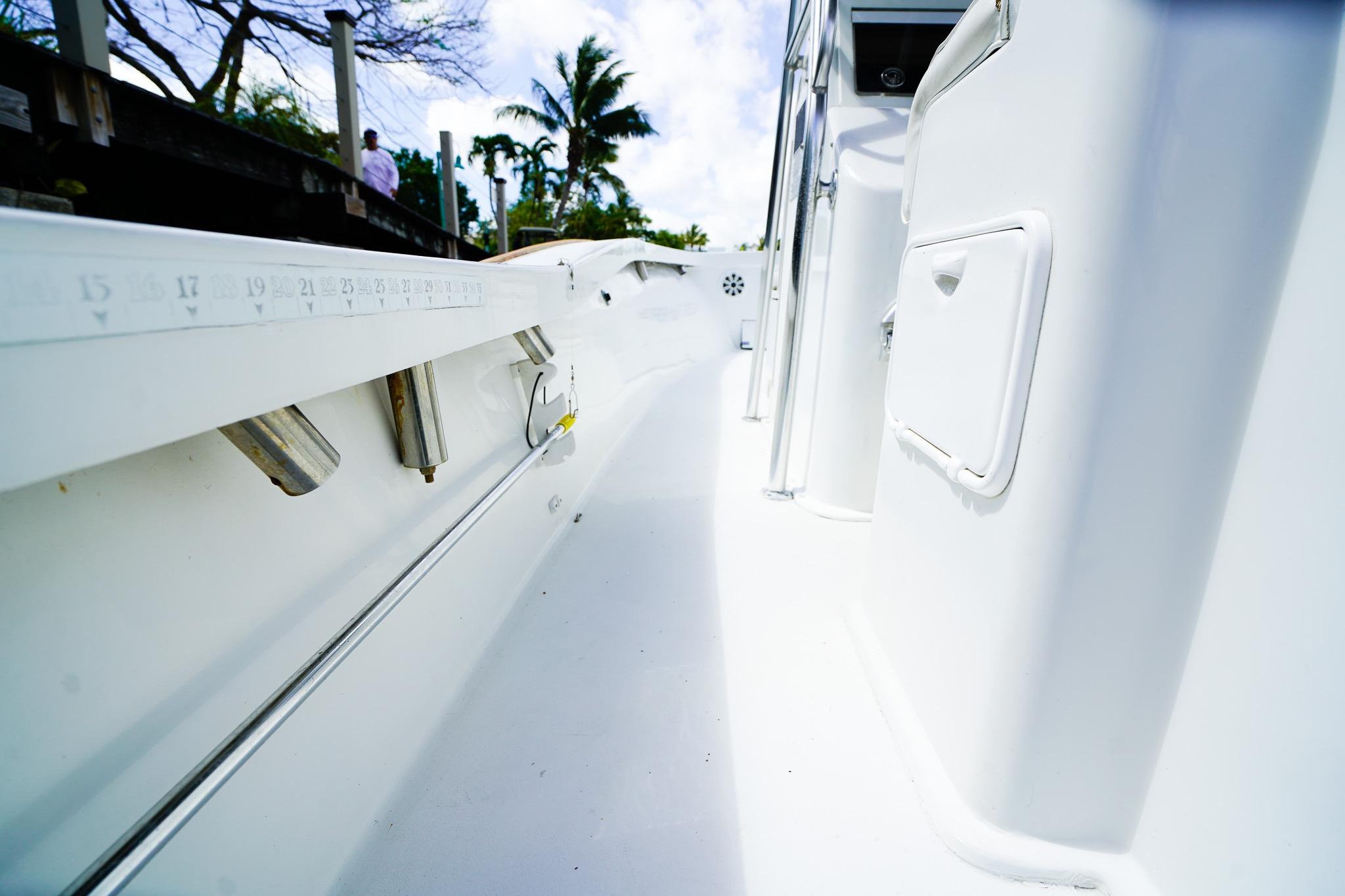 1977 Scarborough 27 CC boat interior with white deck and storage compartments.