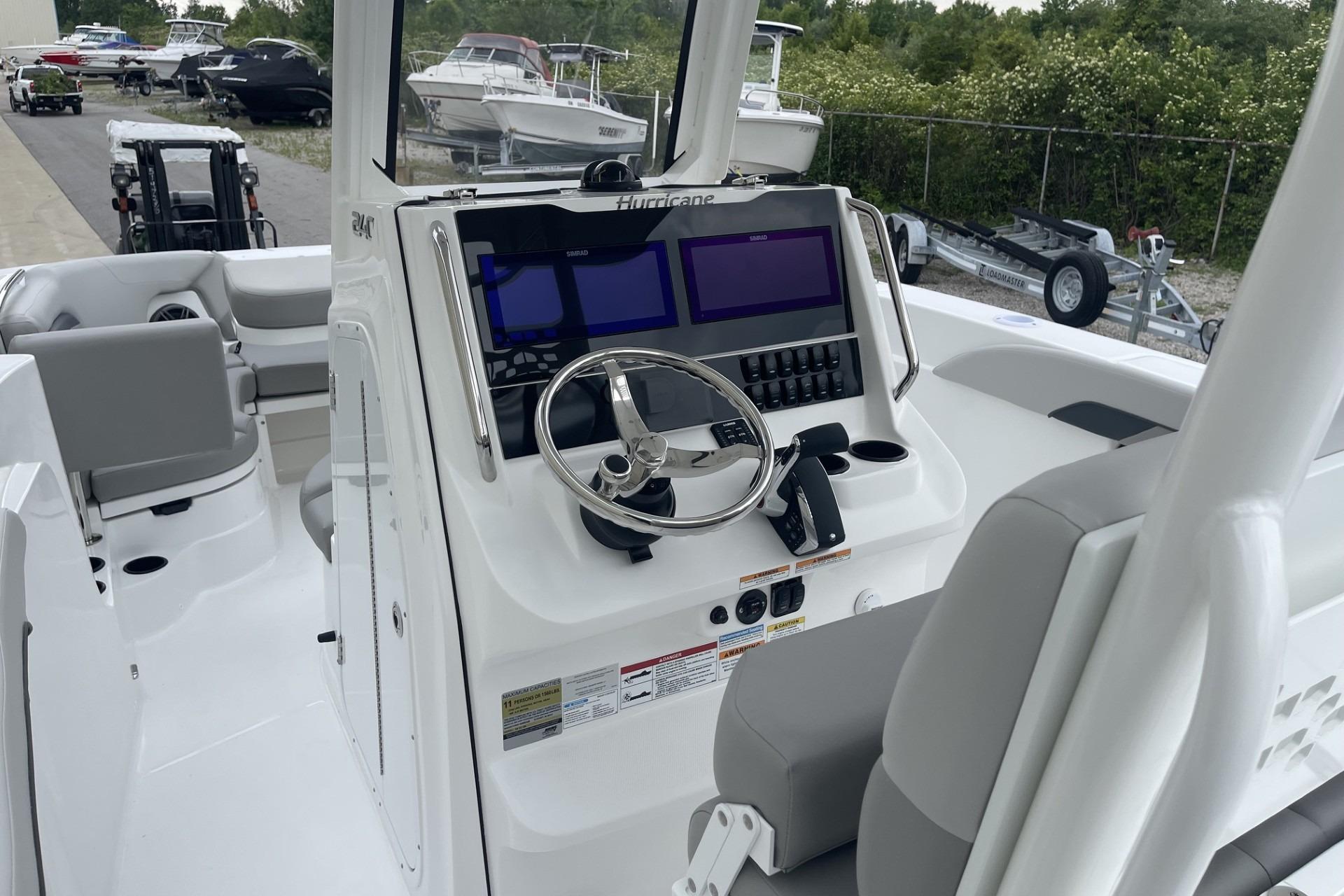 2026 Hurricane Center Console 24 OB boat interior with modern dashboard and steering wheel.