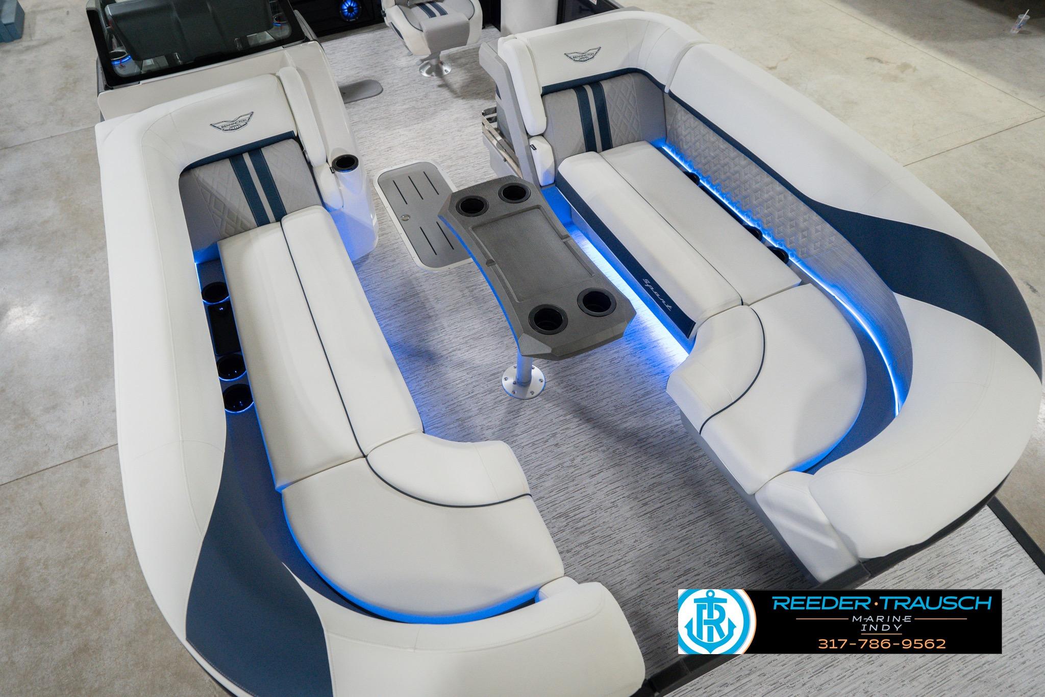 2026 Bennington 24 MCSB boat interior with blue LED lighting and comfortable seating.