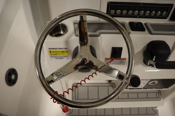 Steering wheel of 2025 Sea Fox 228 Commander boat with control panel.