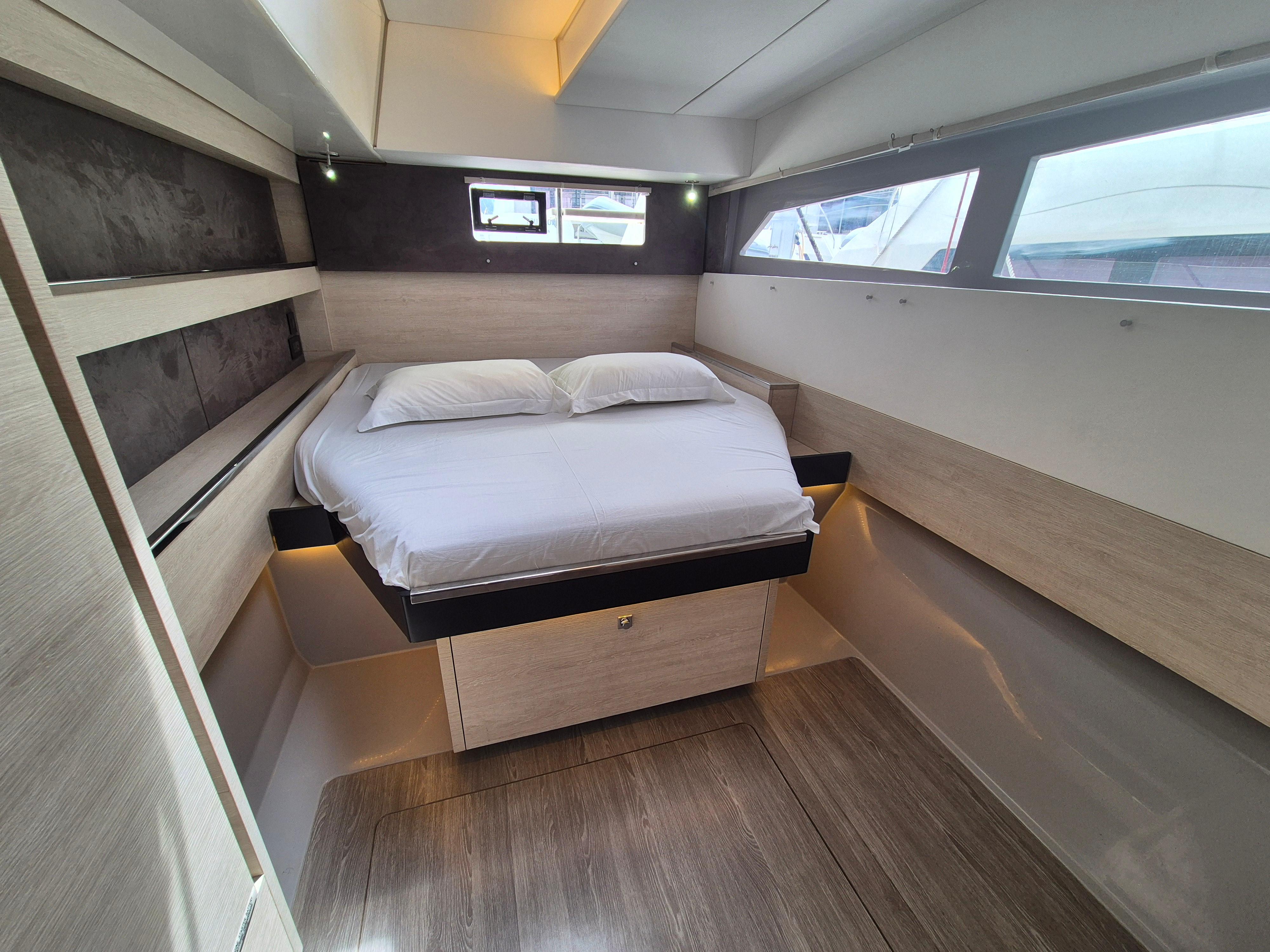 Luxurious cabin interior of a 2020 Leopard 50 yacht with modern design and comfortable bedding.