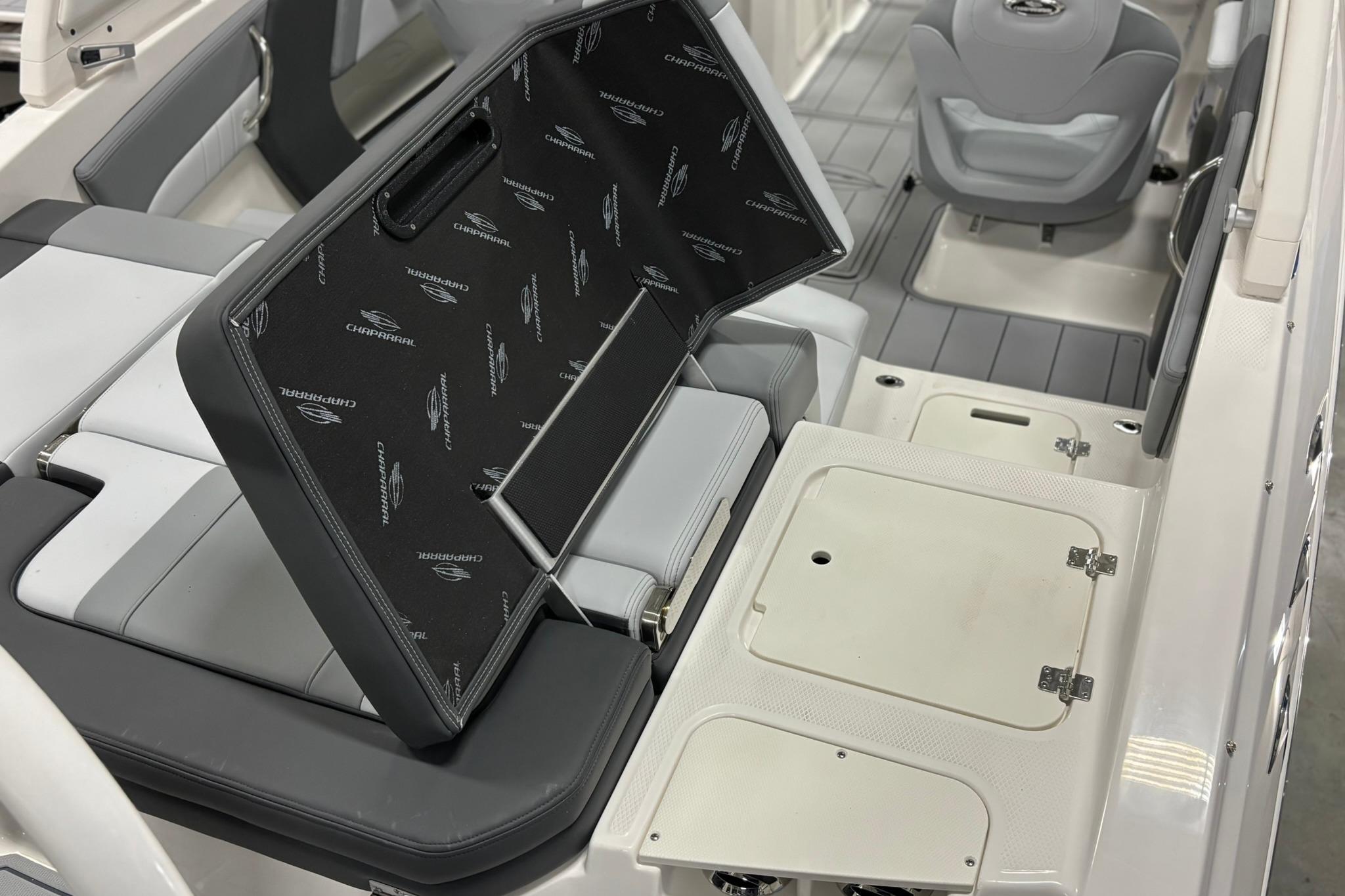 2026 Chaparral 21 SSi OB boat interior with seating and storage compartments.