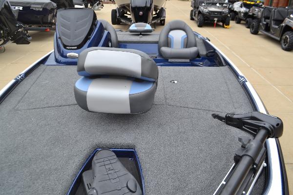 2025 Nitro Z17 boat interior with gray and blue seating, carpeted deck, and trolling motor.