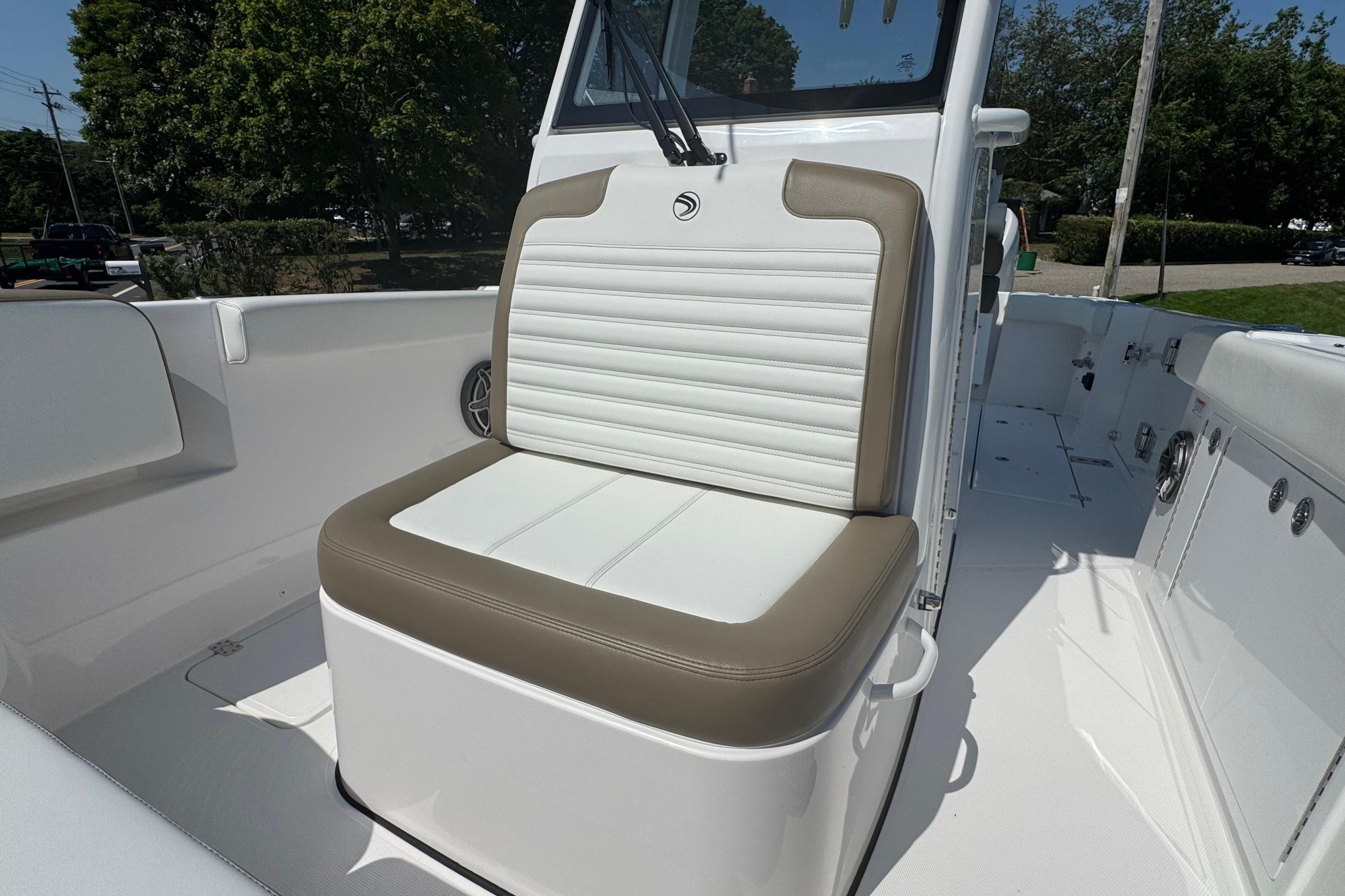 2026 Edgewater 250CC boat interior with cushioned seating and sleek design.