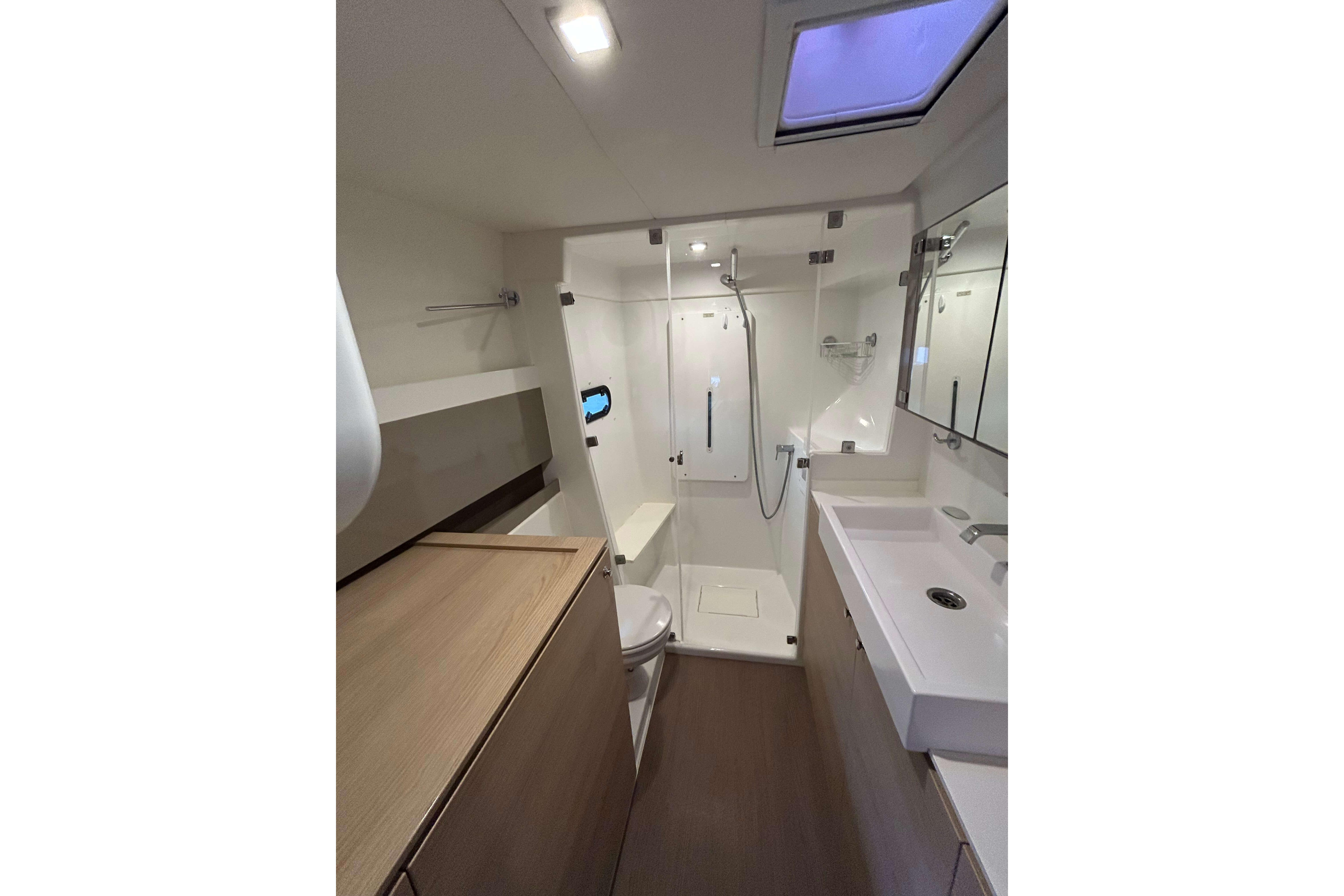 Modern bathroom interior on 2018 Bali 4.1 yacht, featuring shower, sink, and storage.