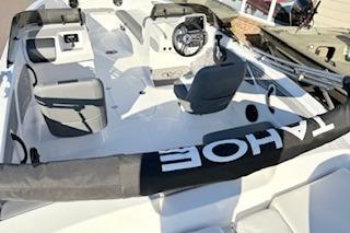 2026 Tahoe T21 boat interior with steering wheel and seating.