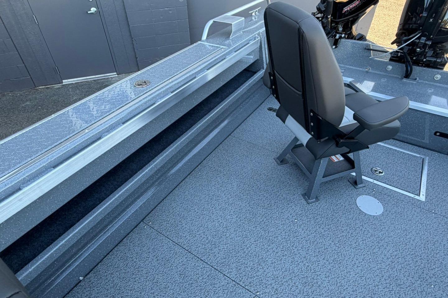 Interior of 2026 Thunder Jet 209 Rush OT boat with seating and storage features.