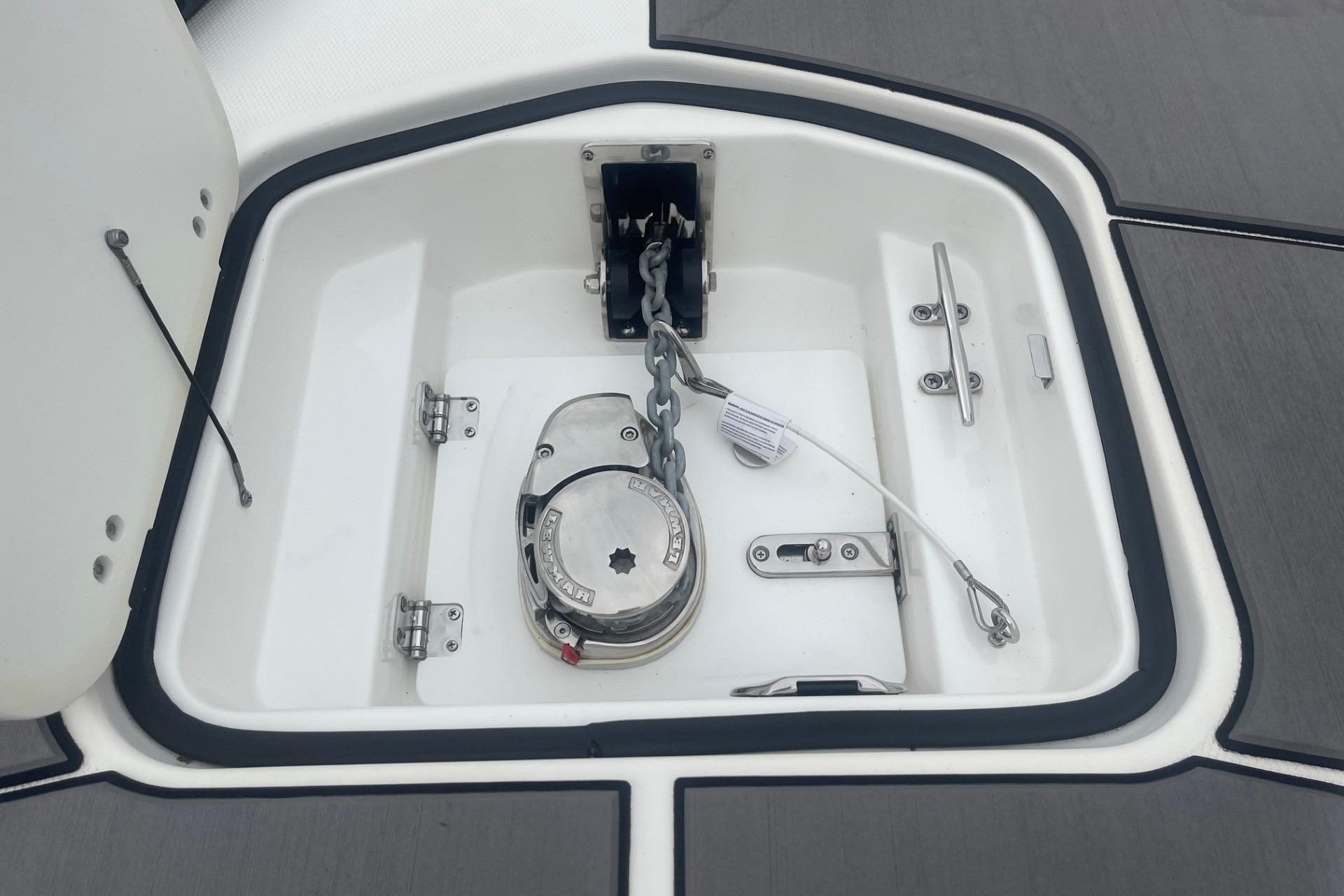 Anchor compartment of 2025 Hurricane Center Console 24 OB boat, featuring a secure chain mechanism.