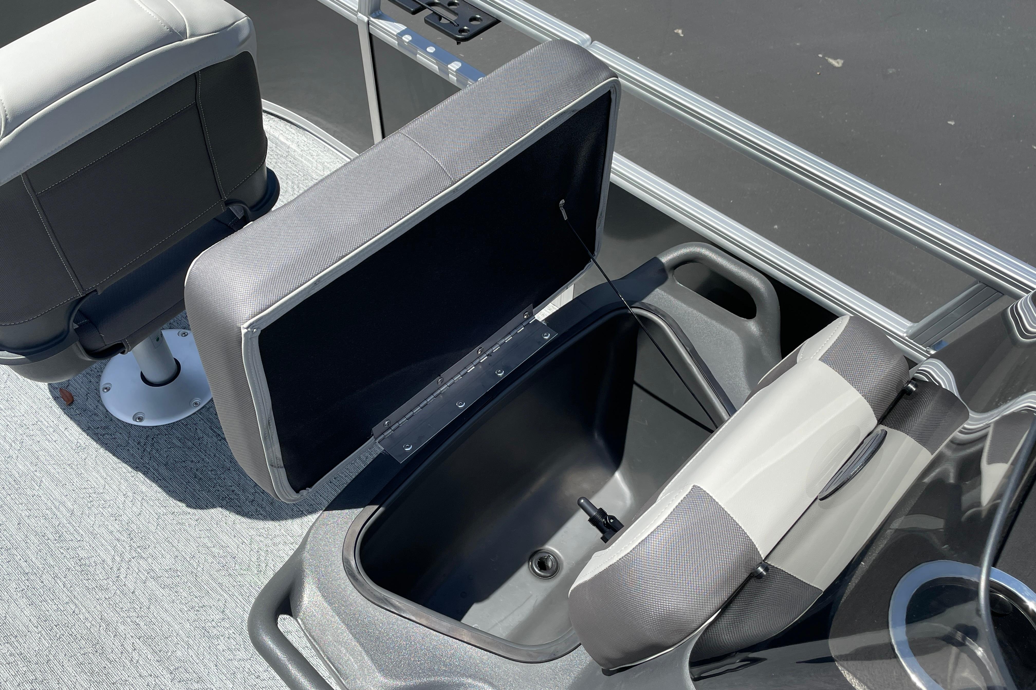 2026 Sun Tracker Bass Buggy 16 XL Select boat interior with open storage compartment and seating.