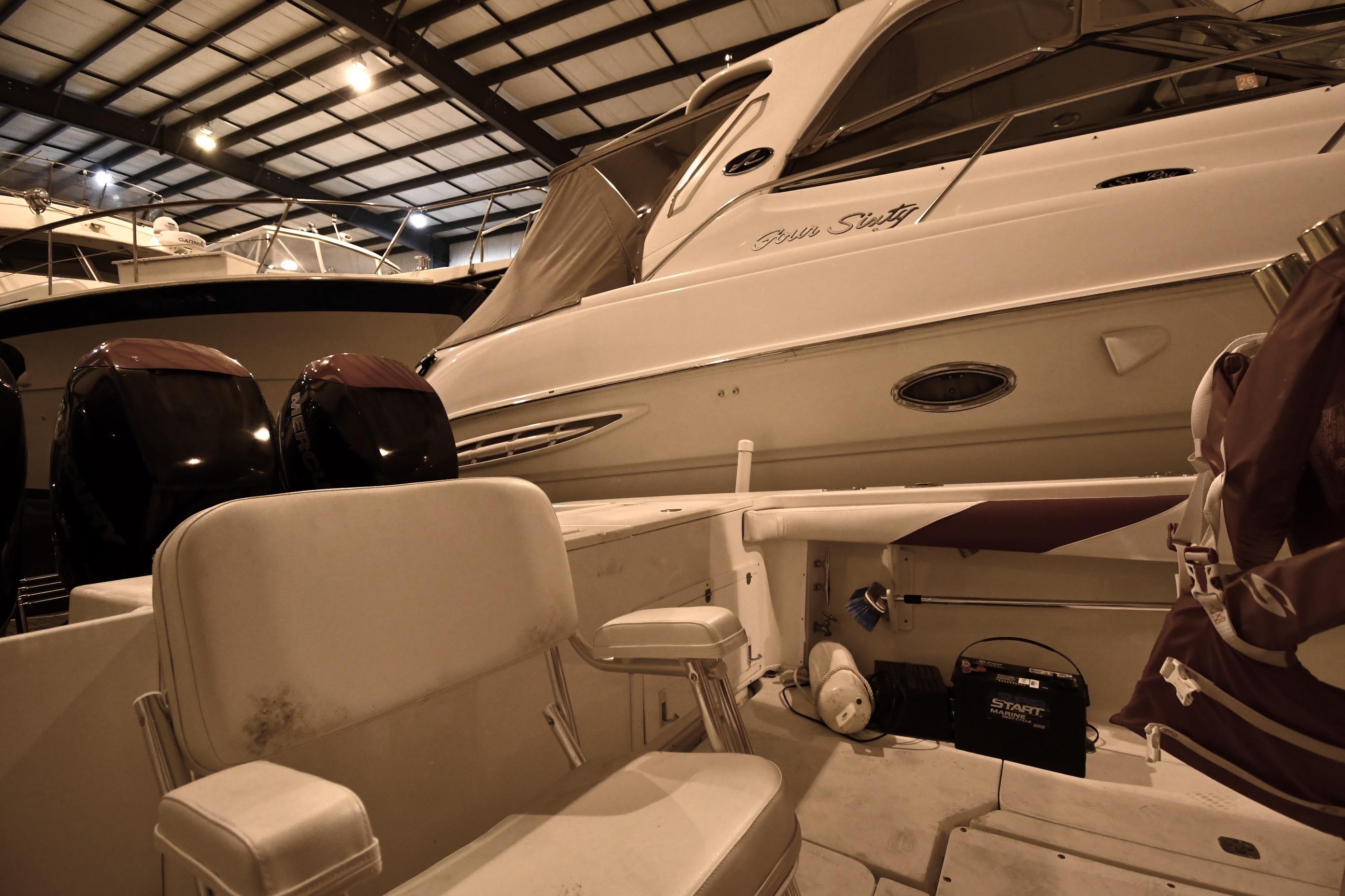 2001 Fountain 38 Center Console boat in indoor storage with twin engines.