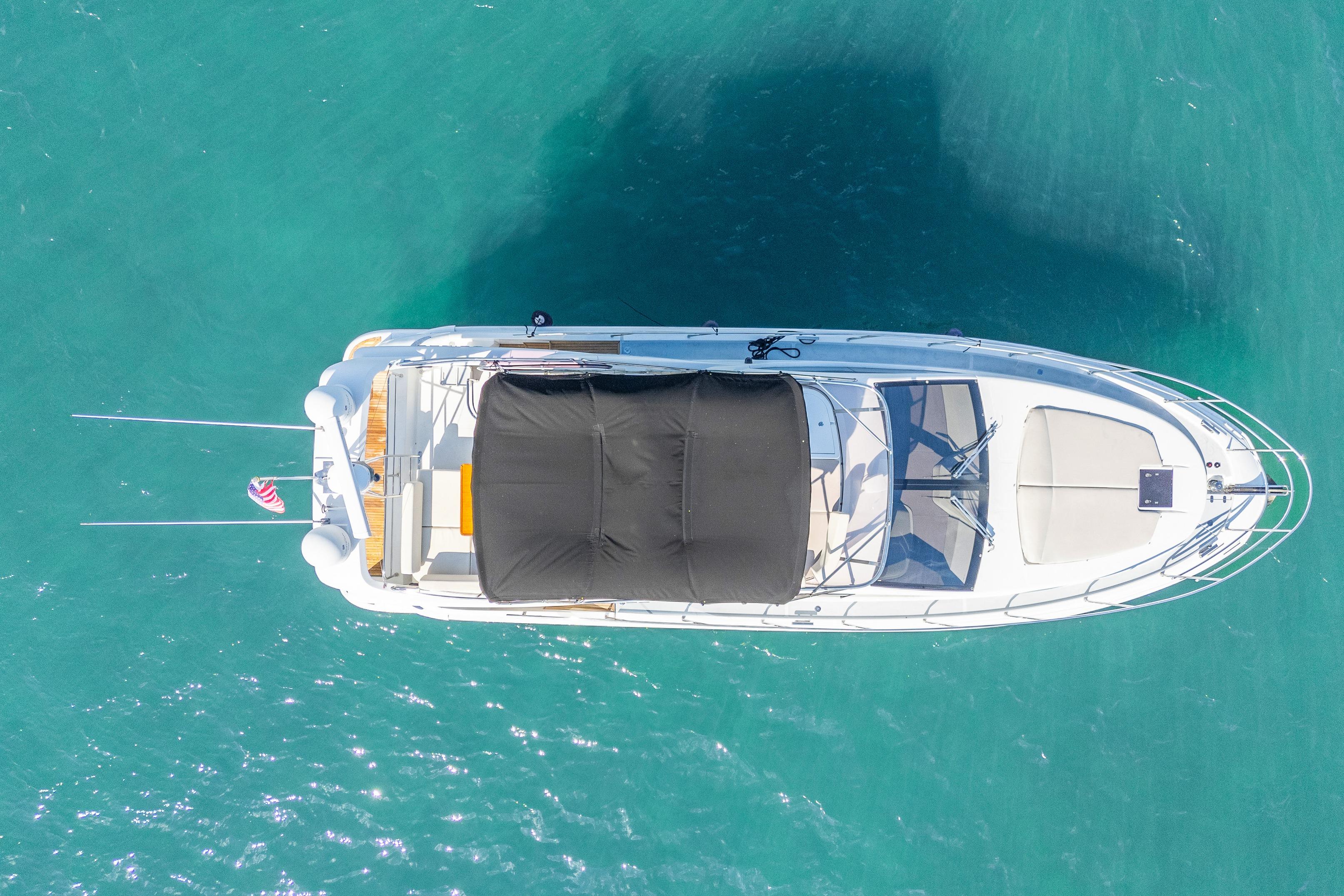 Overhead view of 2013 Azimut 45 Flybridge yacht on turquoise water.