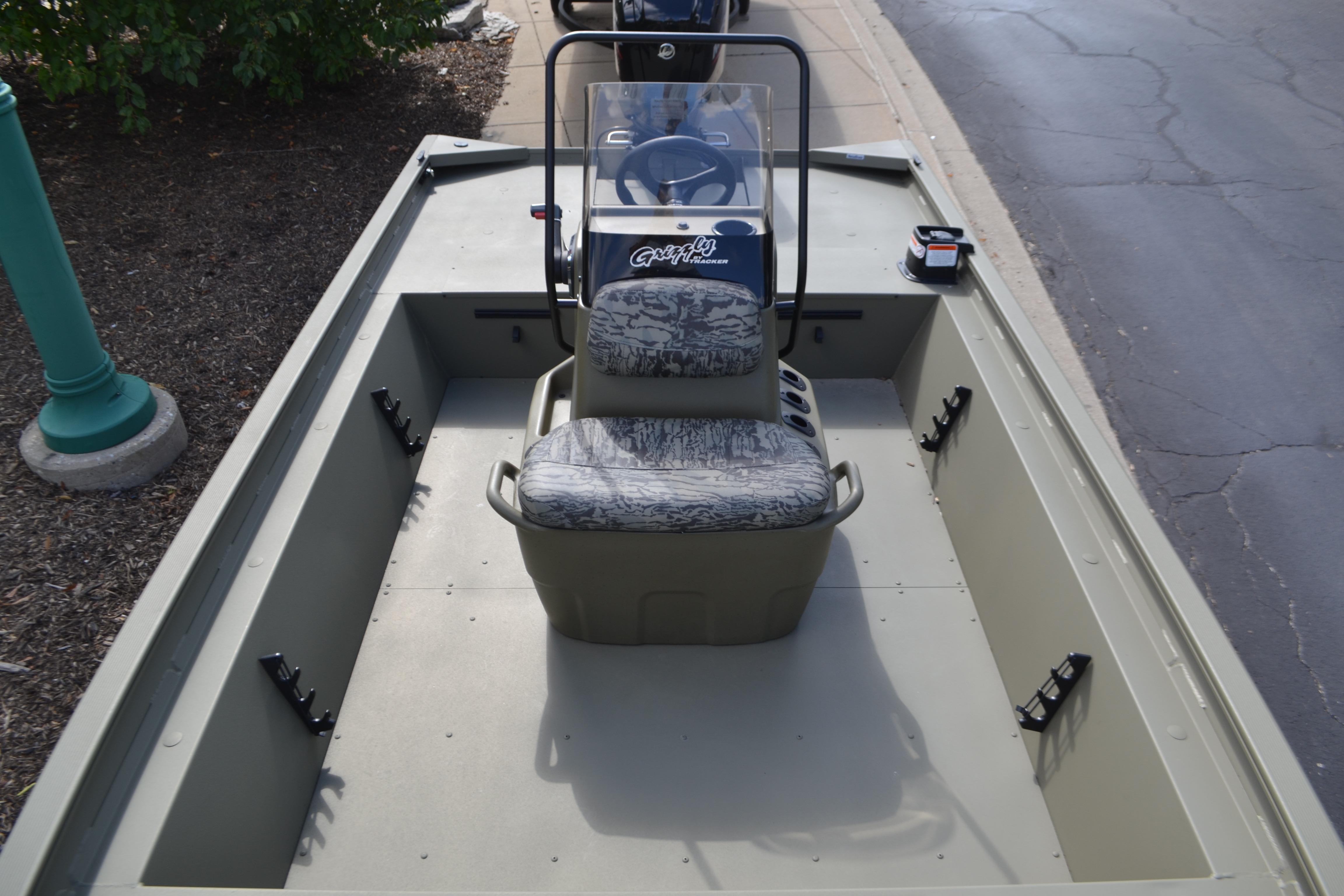 2026 Tracker Grizzly 1860 CC boat interior with central console and seating.