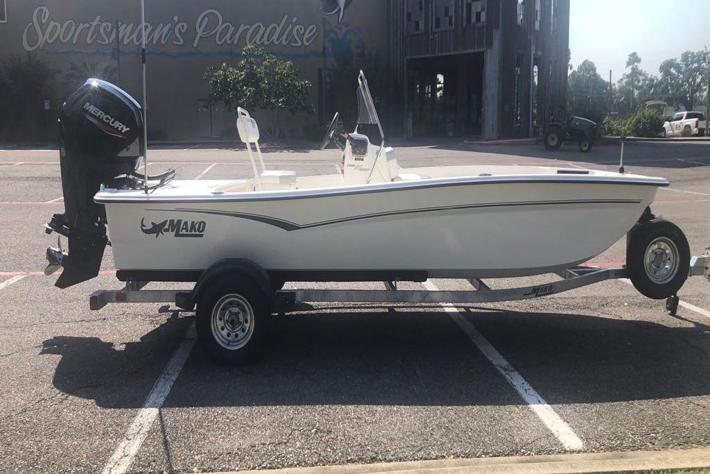2026 Mako Pro Skiff 17 CC boat on trailer in parking lot.