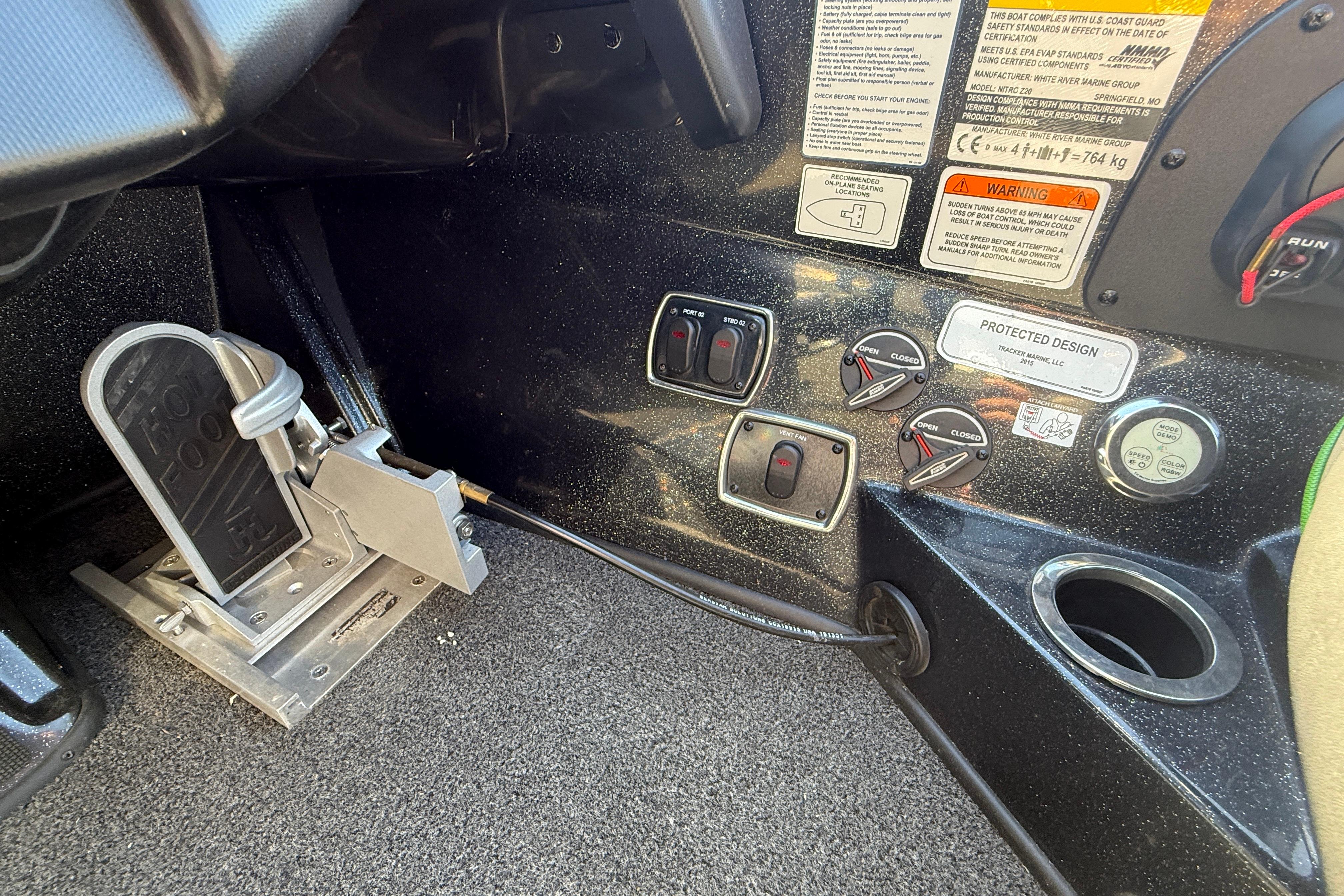 Interior controls of a 2020 Nitro Z20 boat, featuring foot pedal and switches.