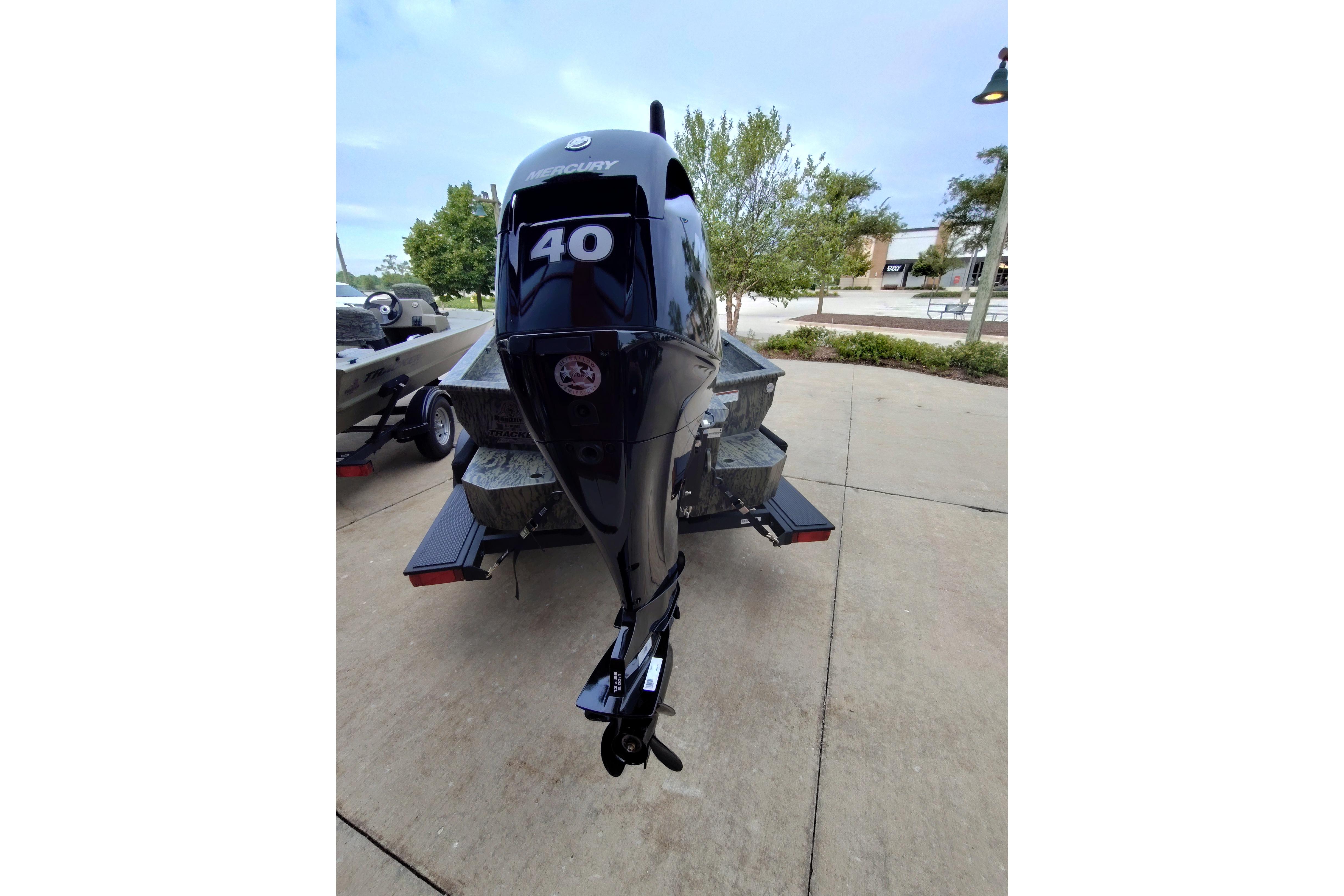 2026 Tracker Grizzly 1650 T Prairie Wings Edition boat with Mercury 40 outboard motor.
