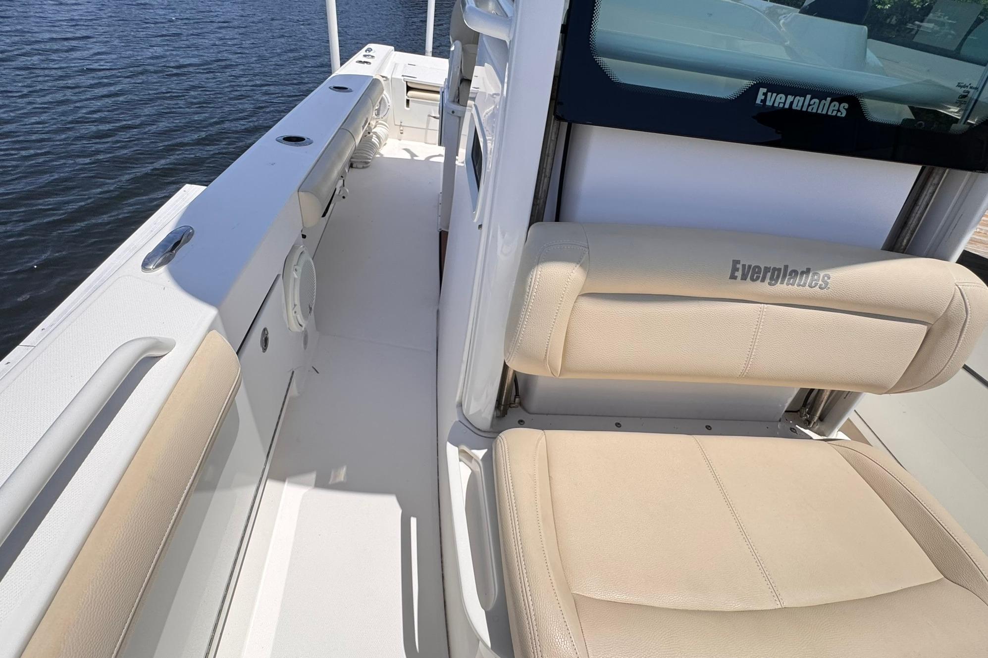2018 Everglades 253 Center Console boat interior with beige seating and sleek design.