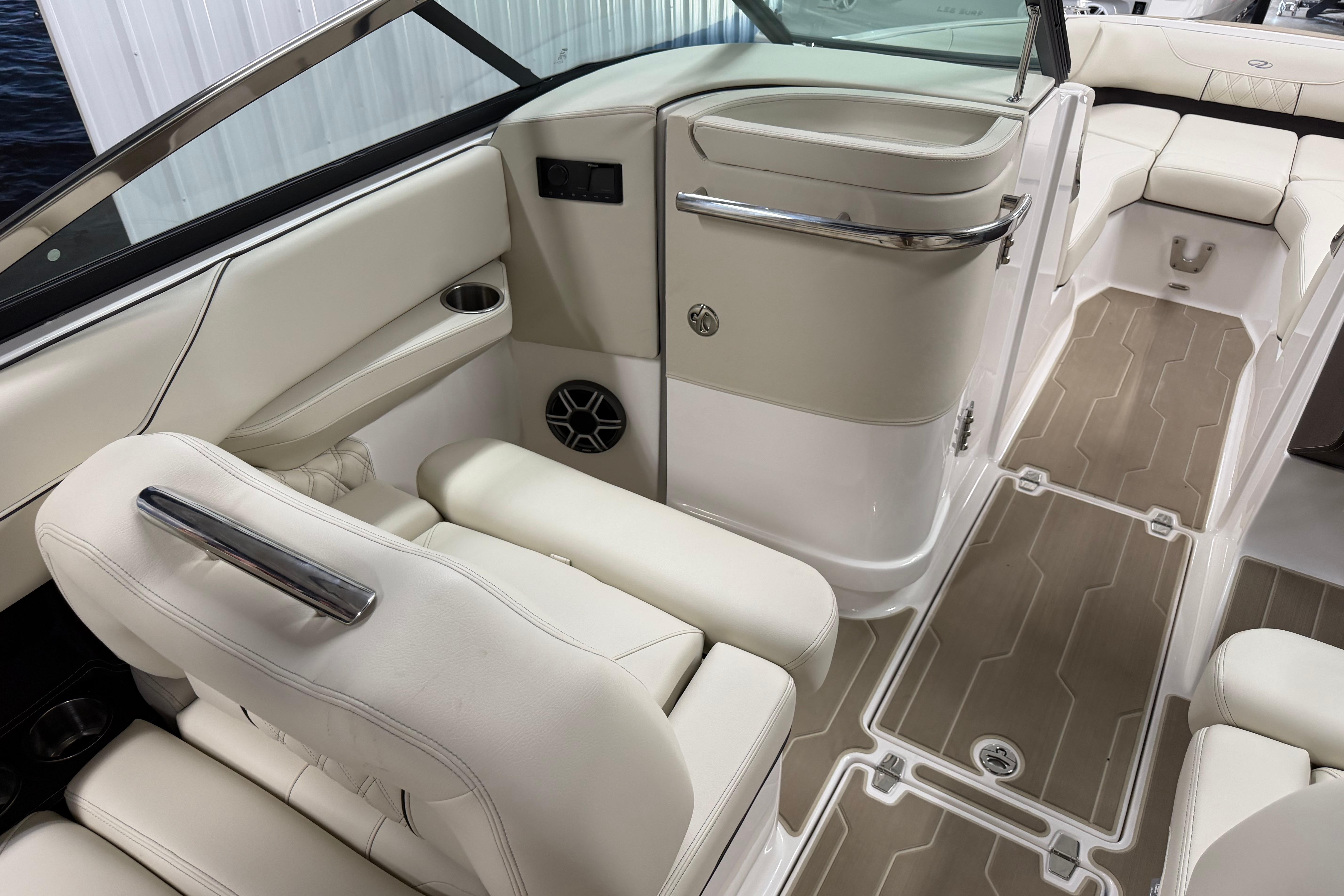 Luxurious interior of 2026 Regal LS6 boat with beige seating and modern design.