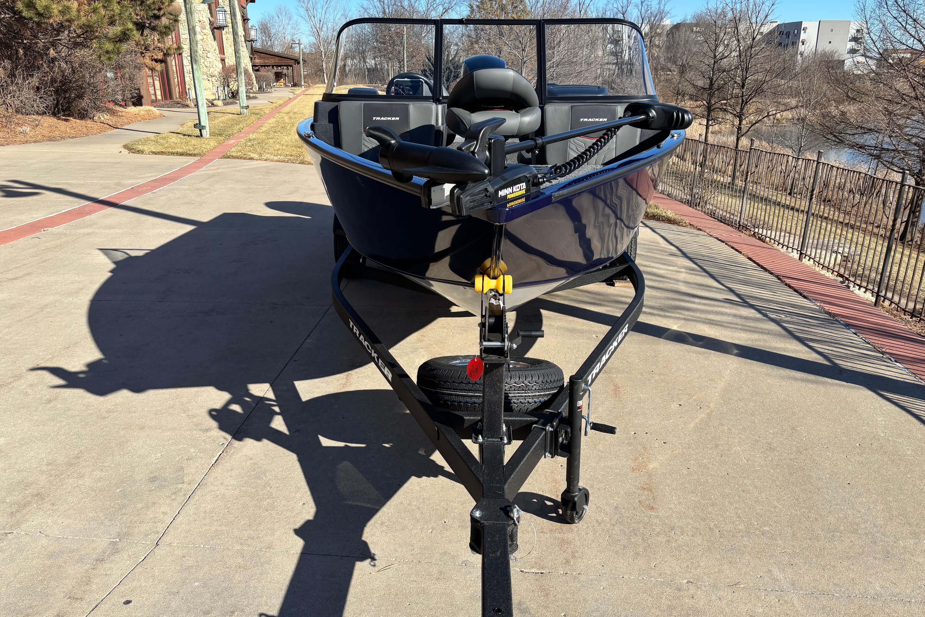 2026 Tracker Pro Guide V-175 Combo boat on trailer, parked outdoors.