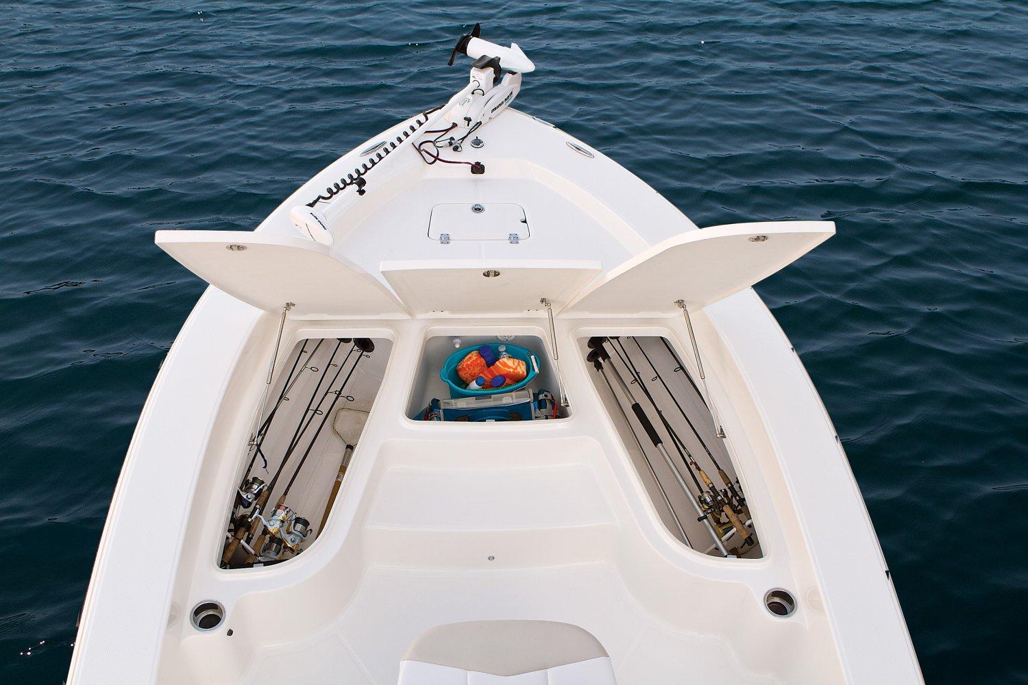 Manufacturer Provided Image: 2017 Robalo 226 Cayman boat with open storage compartments on calm water.