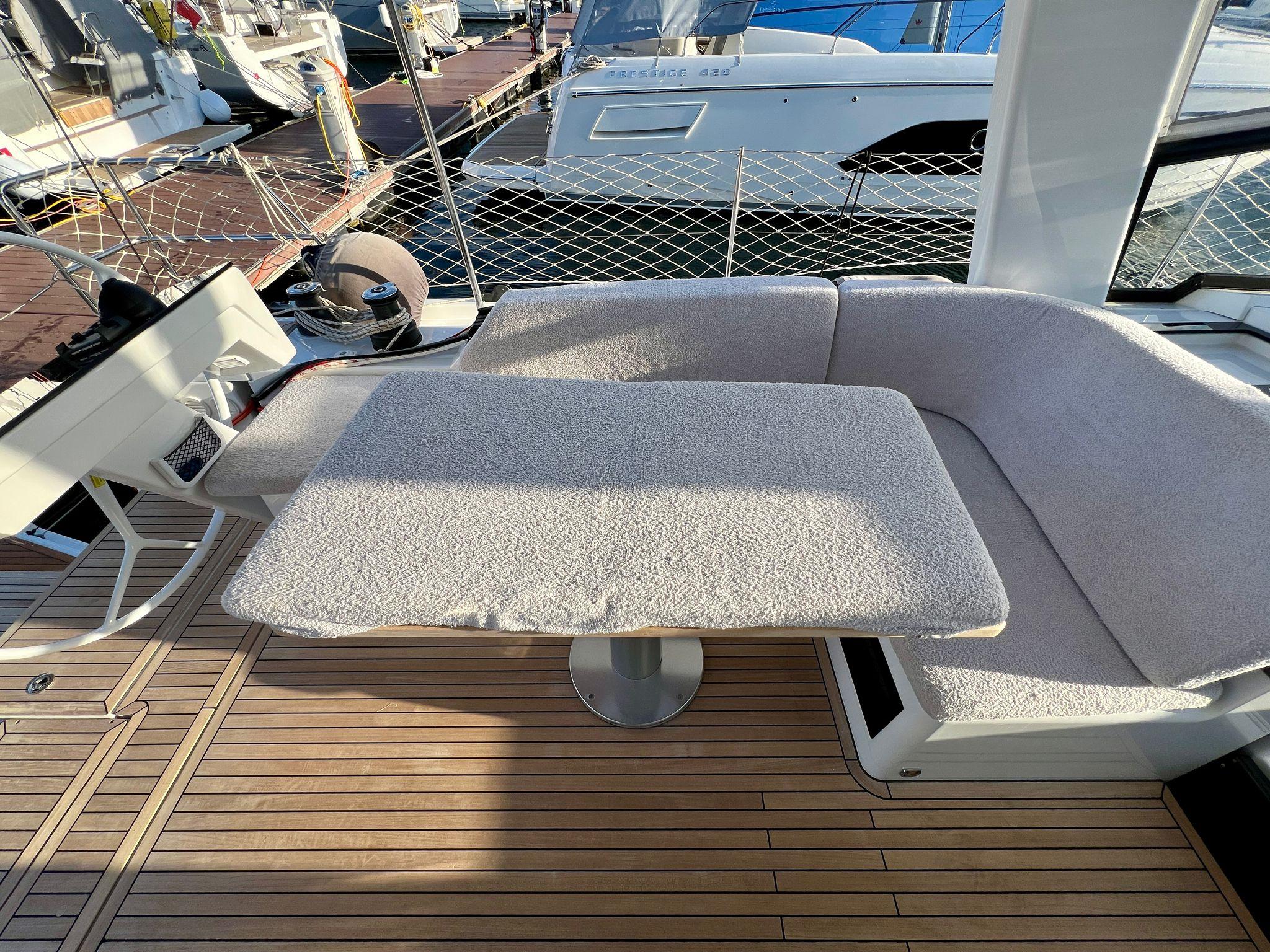 Hanse 460 Yacht 2024 with elegant deck seating area.