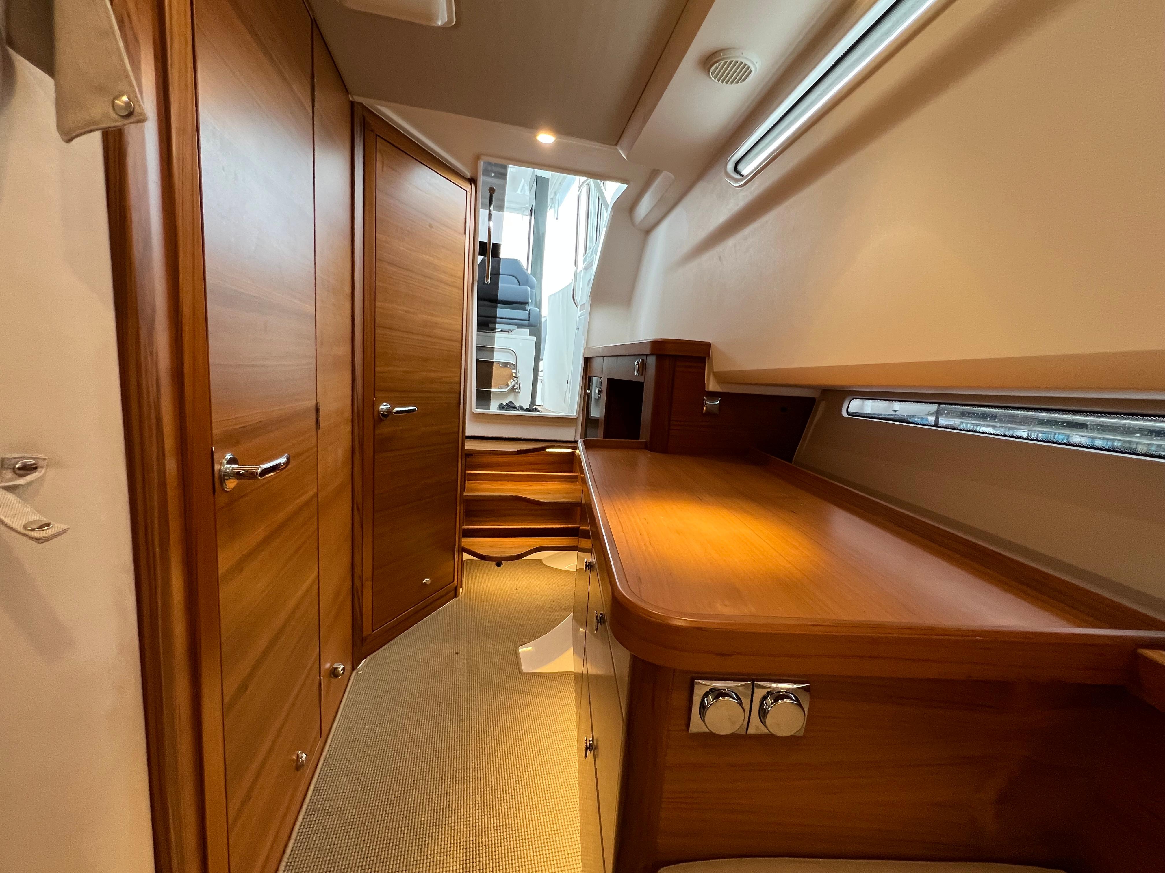 Interior of 2021 Nimbus Tender 11, featuring wooden cabinetry and modern design elements.