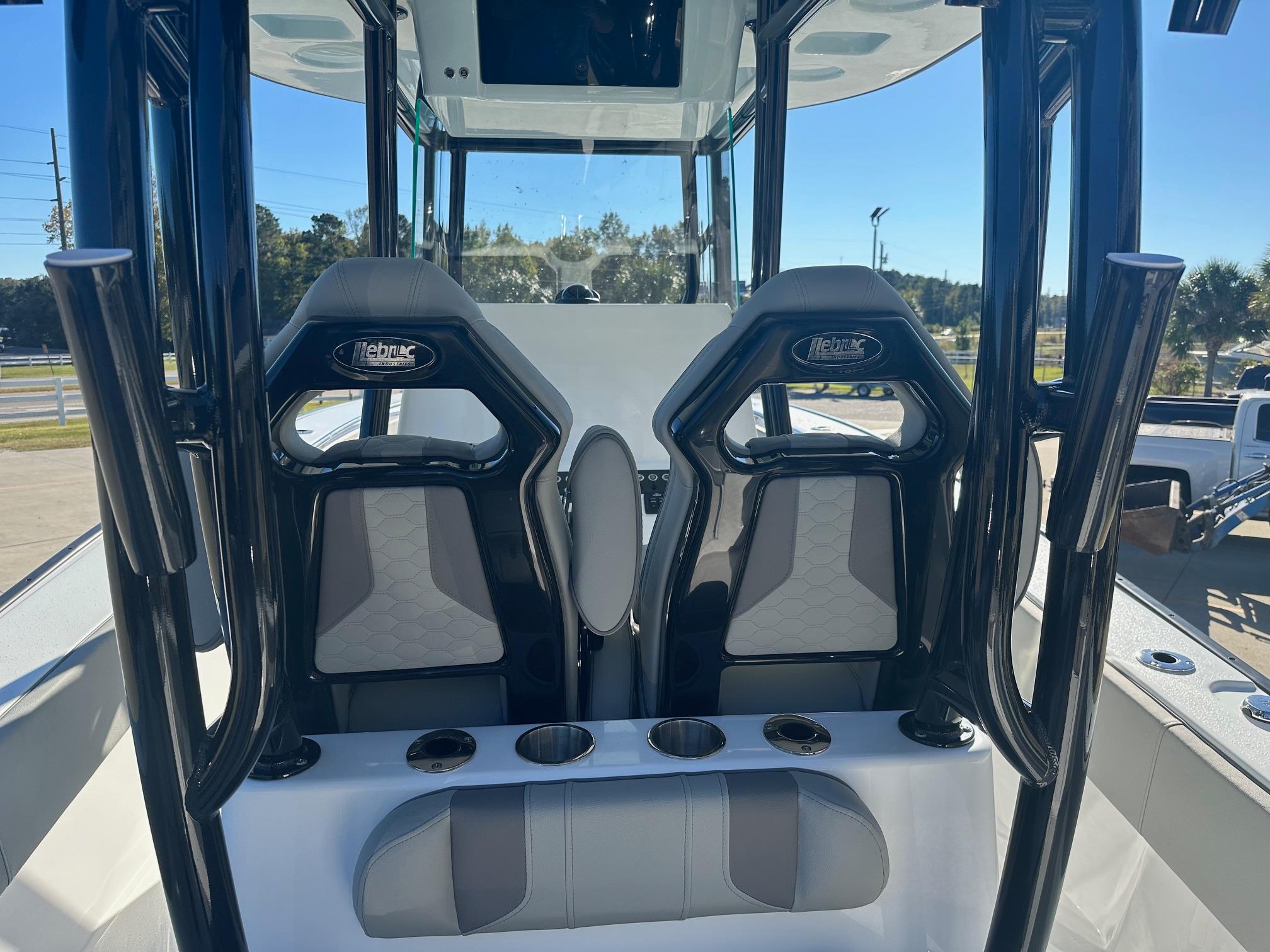 2025 Cape Horn 28XS boat interior with two sleek helm seats and cup holders.