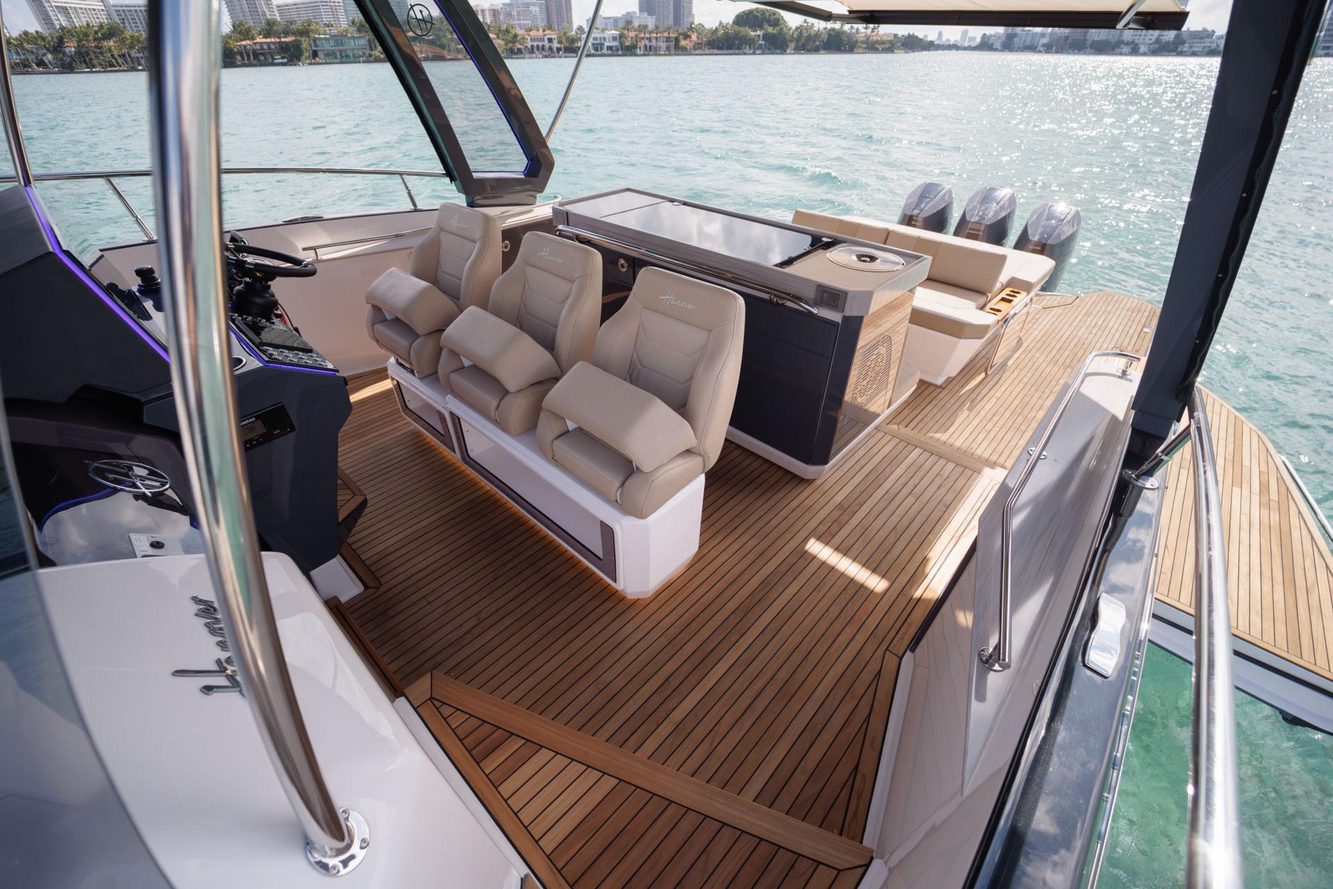 Luxurious 2026 Hanover 447 yacht interior with plush seating and sleek design on open water.