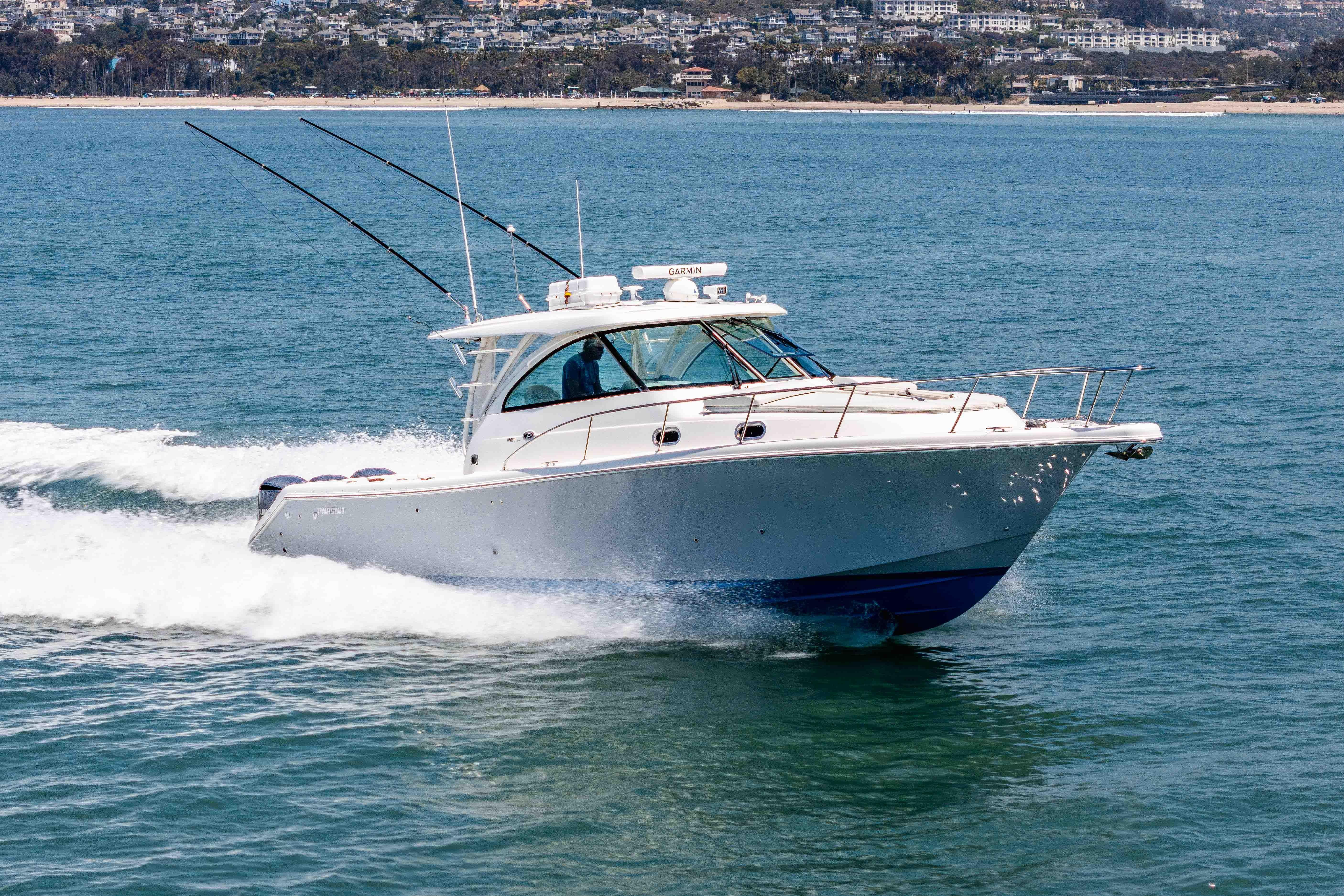 2022 Pursuit OS 385 Offshore boat cruising on open water.