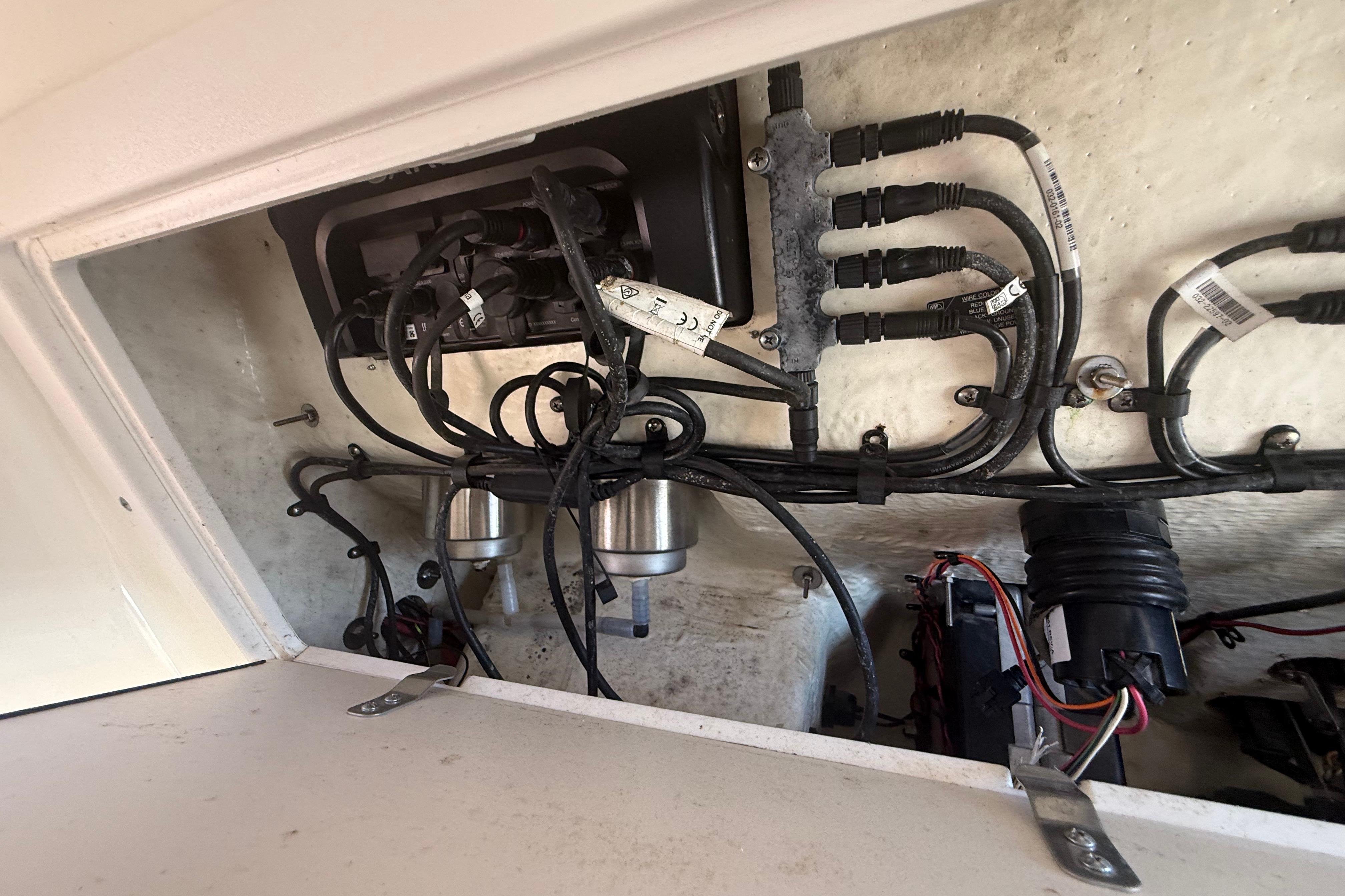 2019 Key West Billistic 281 Center Console wiring and components inside compartment.