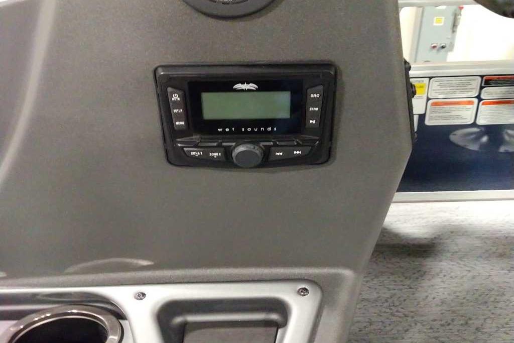 Control panel of 2026 Sun Tracker Bass Buggy 18 DLX with audio system.