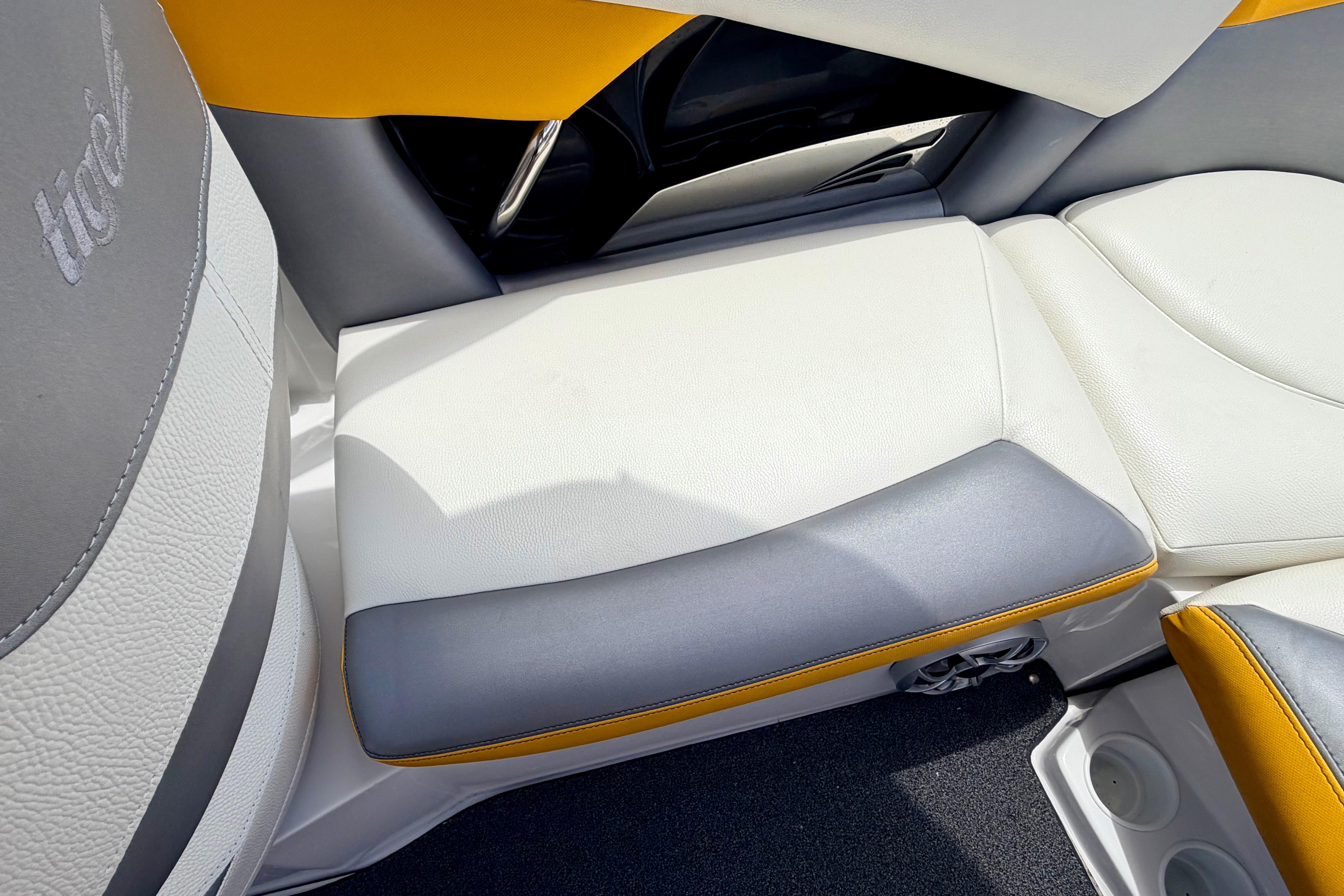 2014 Tigé R20 boat interior with white, gray, and yellow seating.