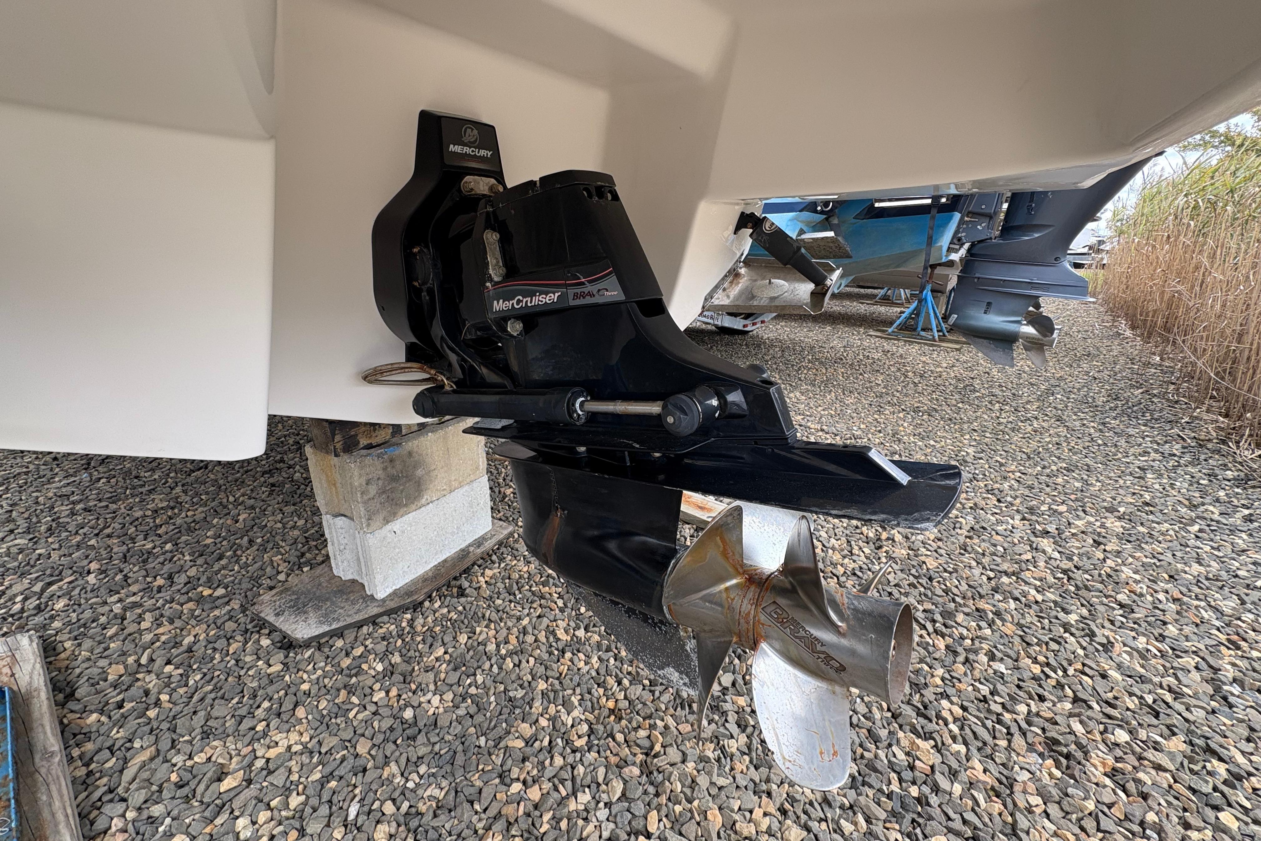 2015 Chaparral 264 Sunesta boat with MerCruiser outdrive on gravel.