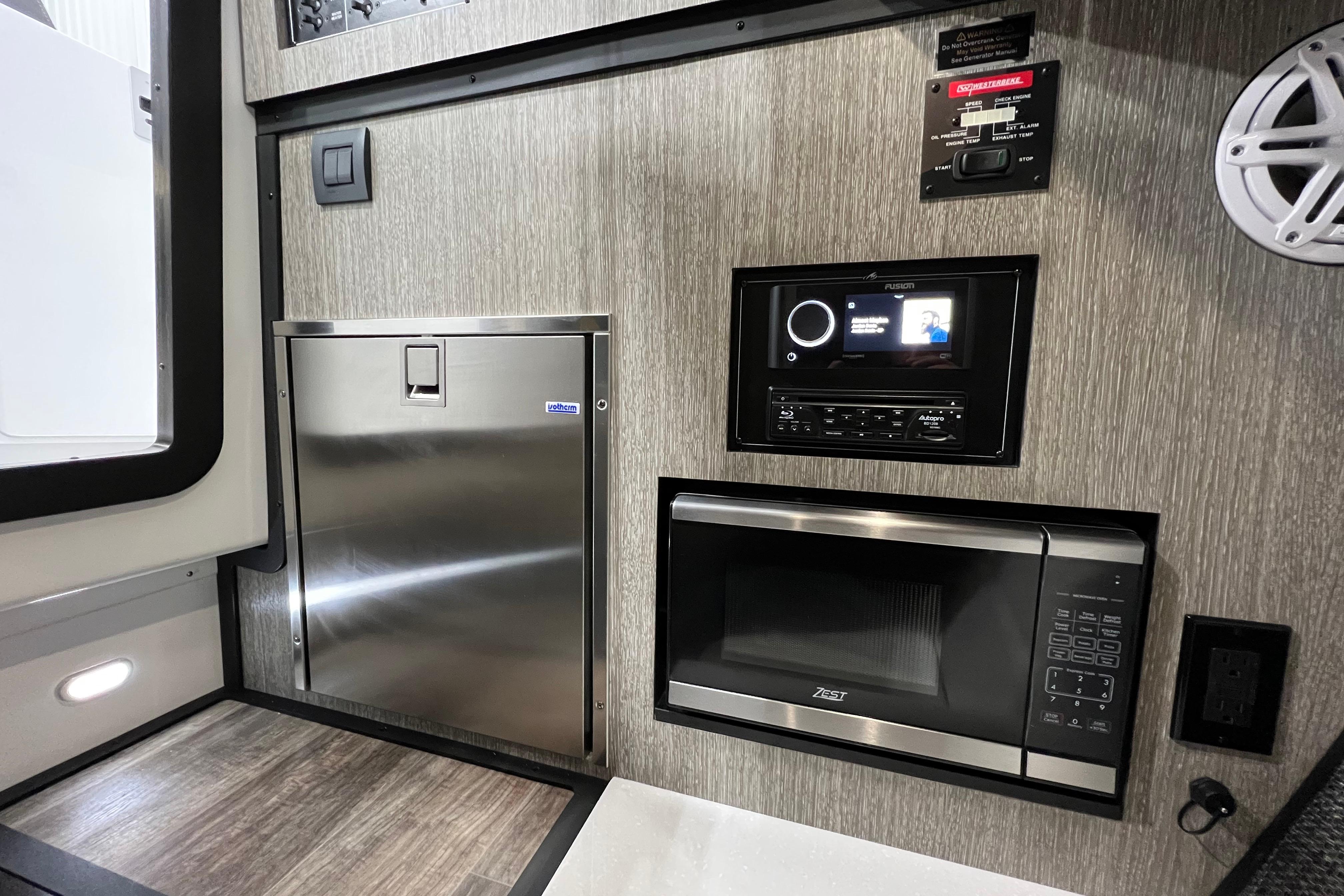 2023 Monterey 378SS Super Sport interior with stainless appliances and modern entertainment system.