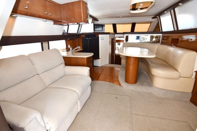 Luxurious interior of 2008 Carver 43 Super Sport yacht with plush seating and modern amenities.