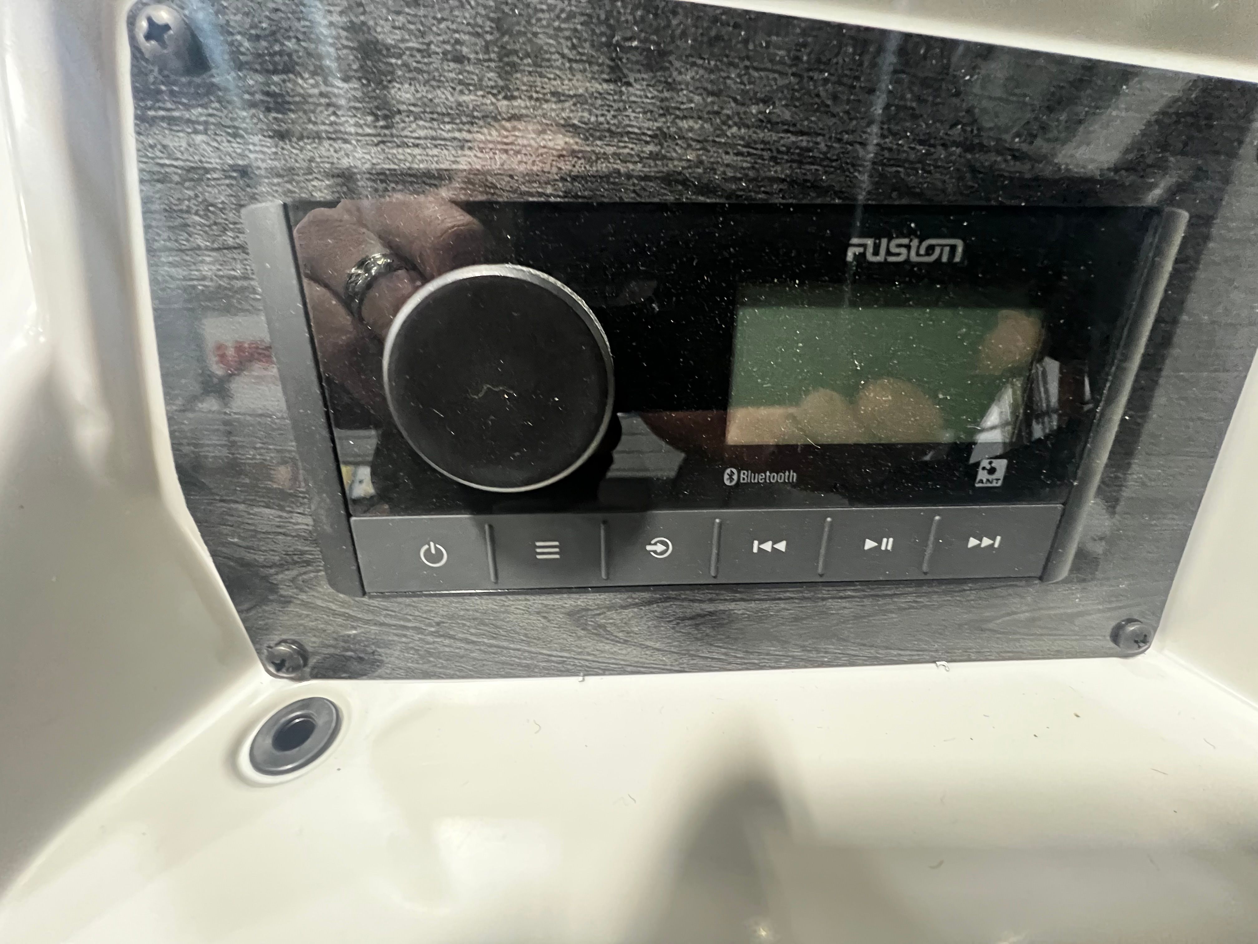 Fusion Bluetooth stereo system in 2026 Tahoe 2180 Sport Quad Lounger.