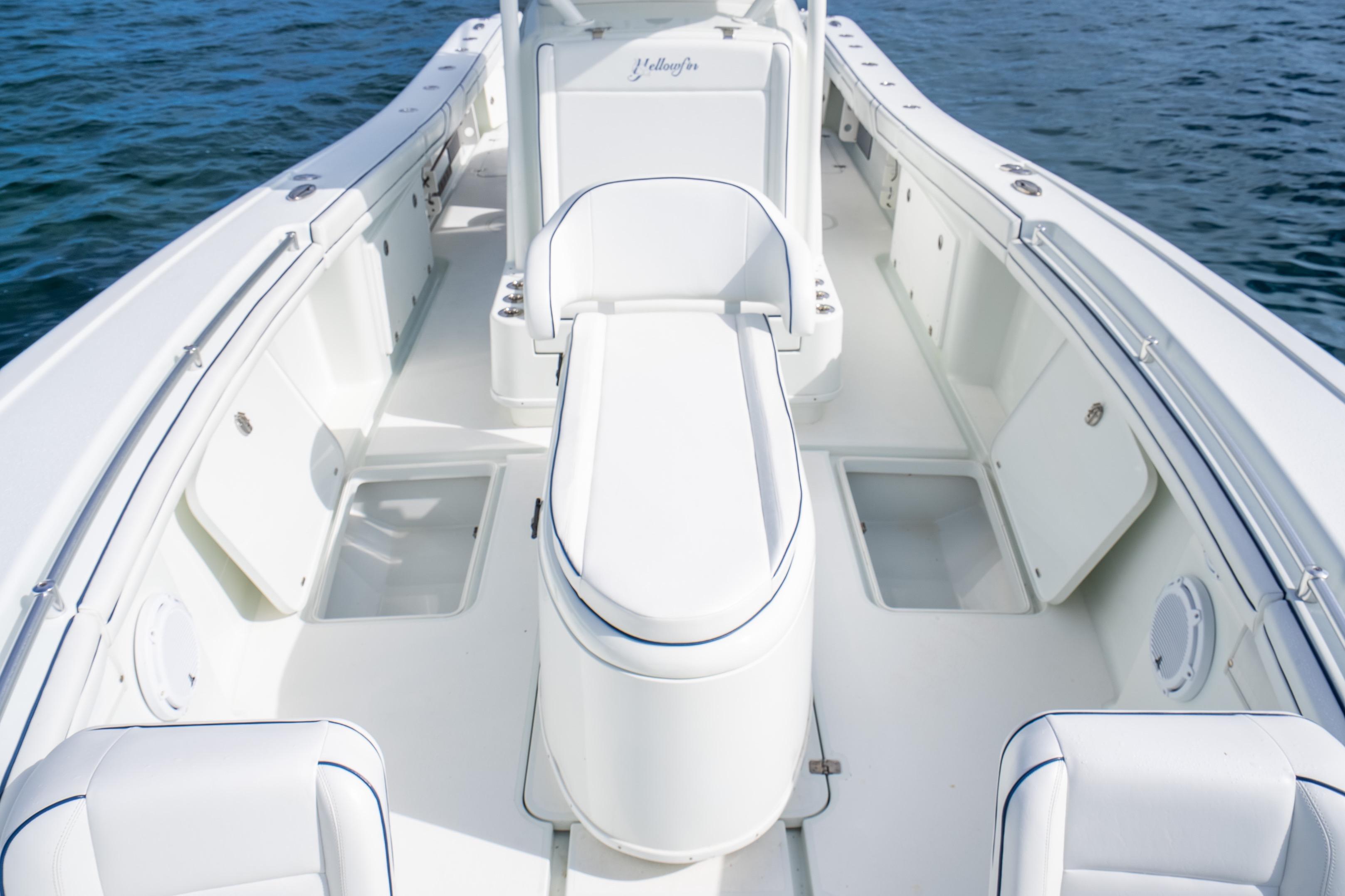 2016 Yellowfin 36 Offshore boat interior with white seating and storage compartments.
