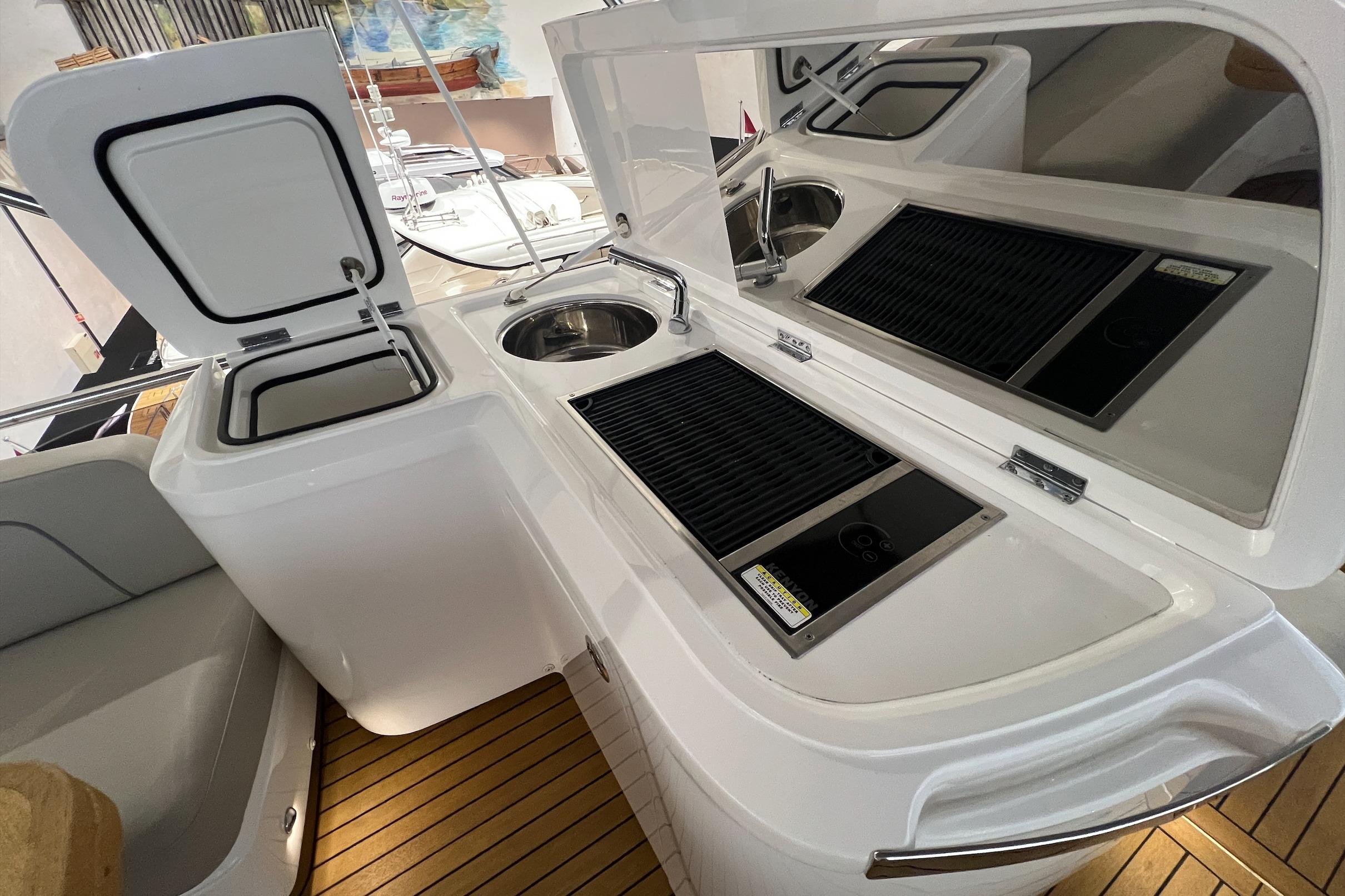Luxurious 2019 Princess F45 yacht kitchen with sink and grill on deck.
