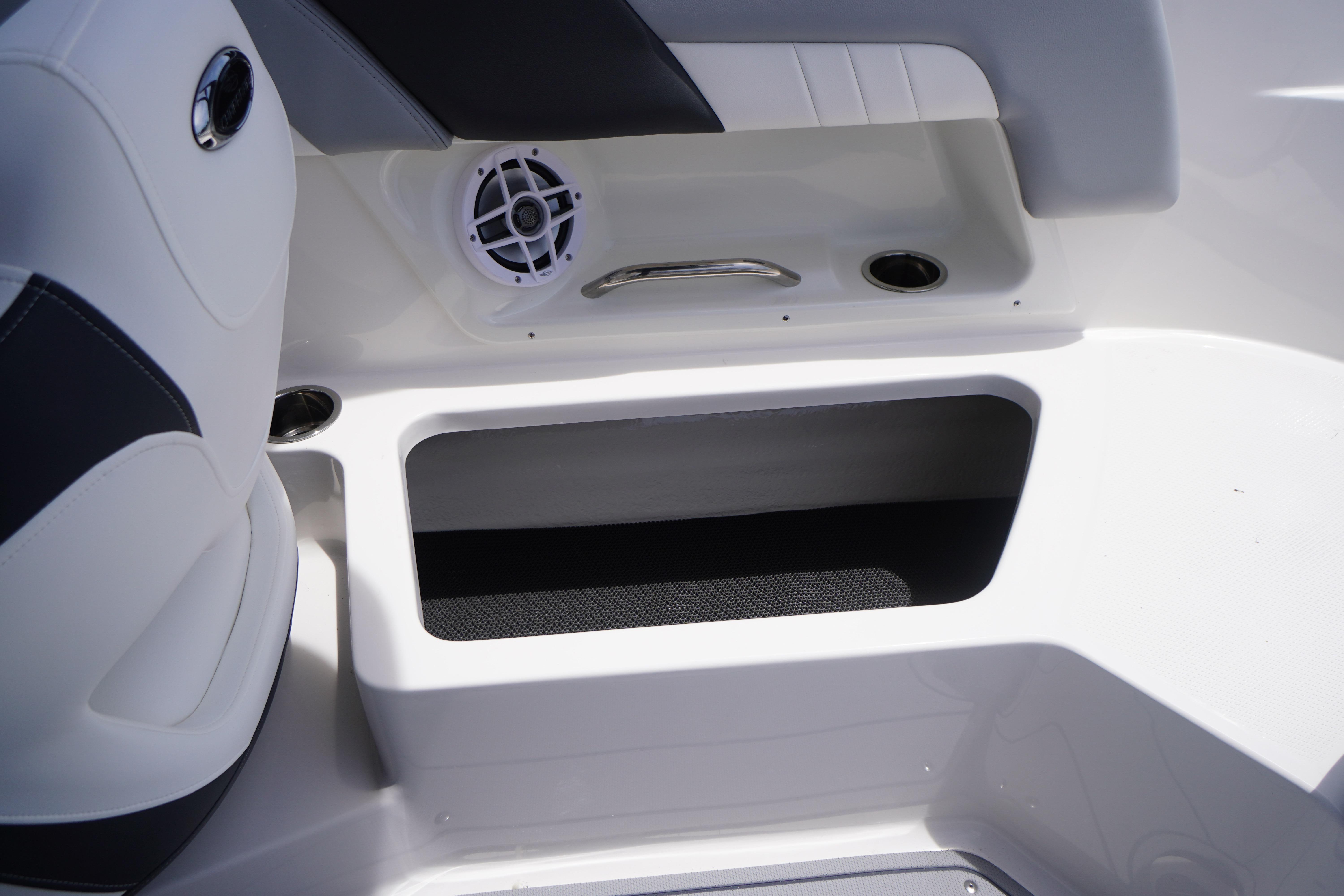 Interior view of 2026 Chaparral 23 SSi OB boat, featuring seating and speaker.