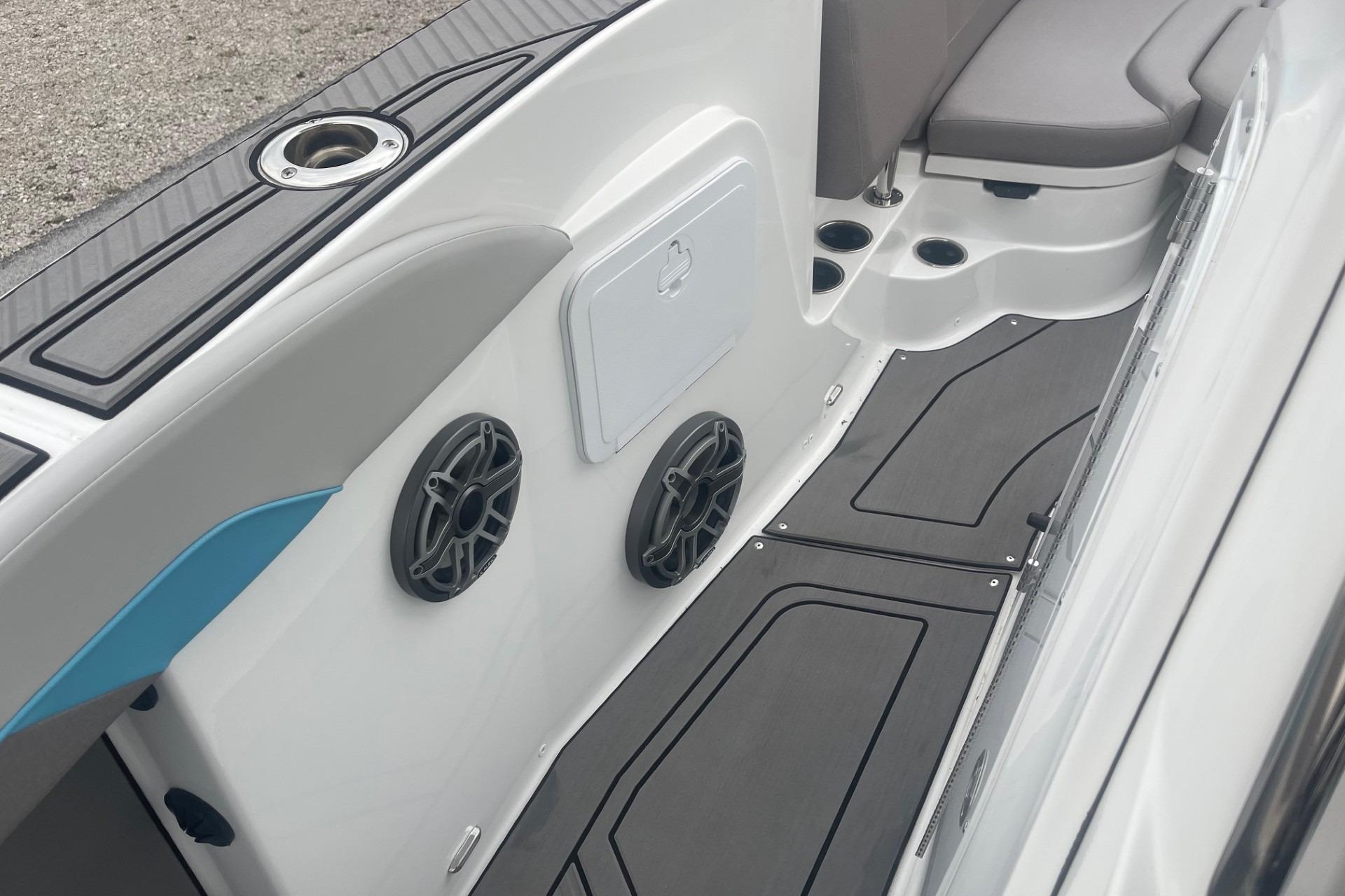 2025 Hurricane Center Console 24 OB boat interior with speakers and seating.