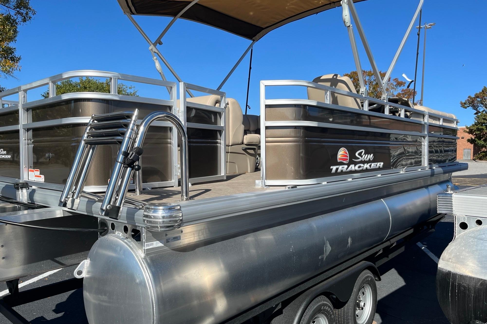 2025 Sun Tracker SportFish 22 DLX pontoon boat with sleek design and sturdy aluminum frame.