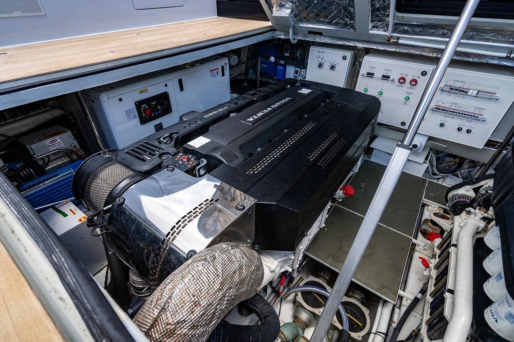 Engine room of 2023 Bluegame BG 72 yacht, featuring advanced machinery and control panels.