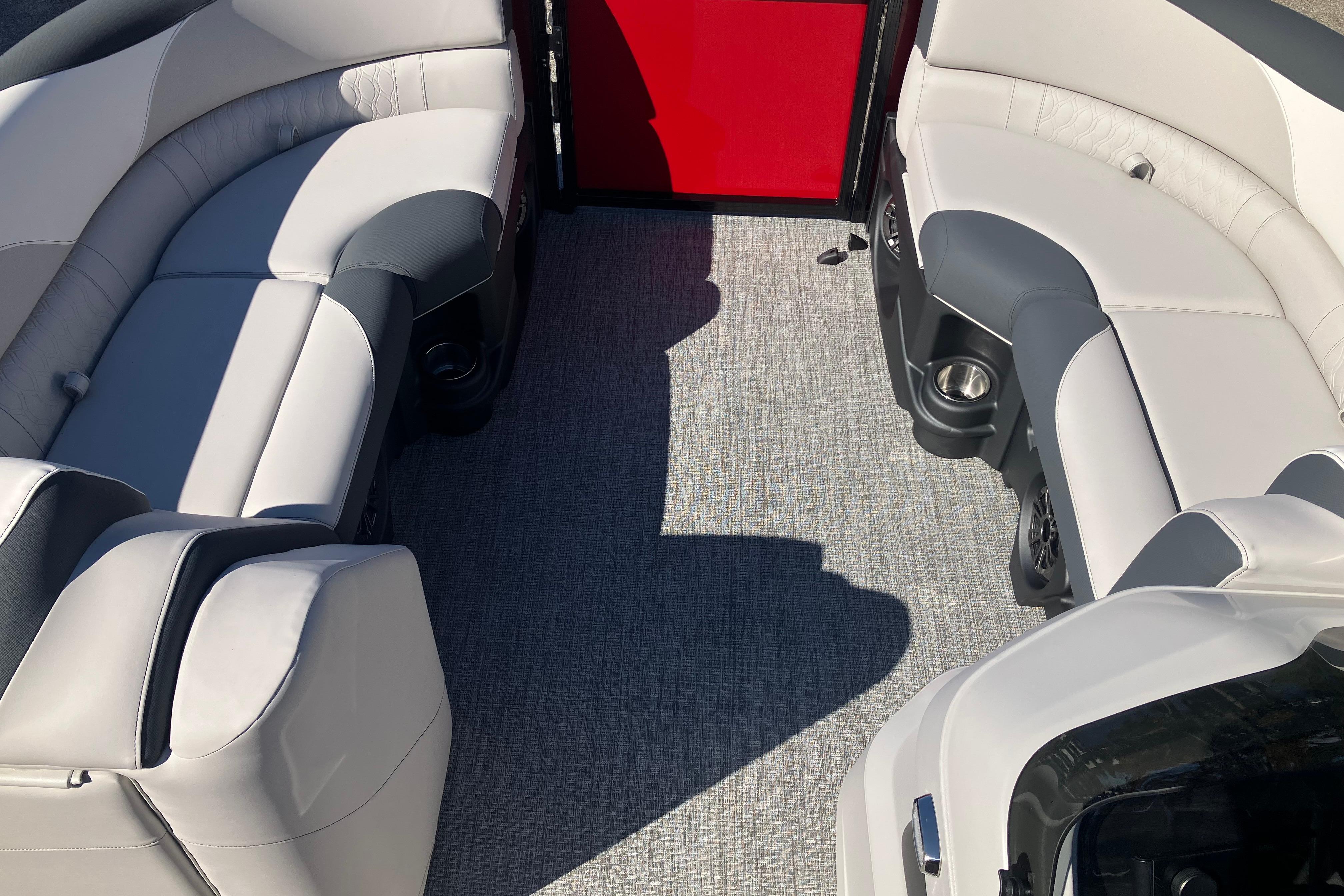 2026 Tahoe Pontoon LTZ Quad Lounger interior with plush seating and modern design.
