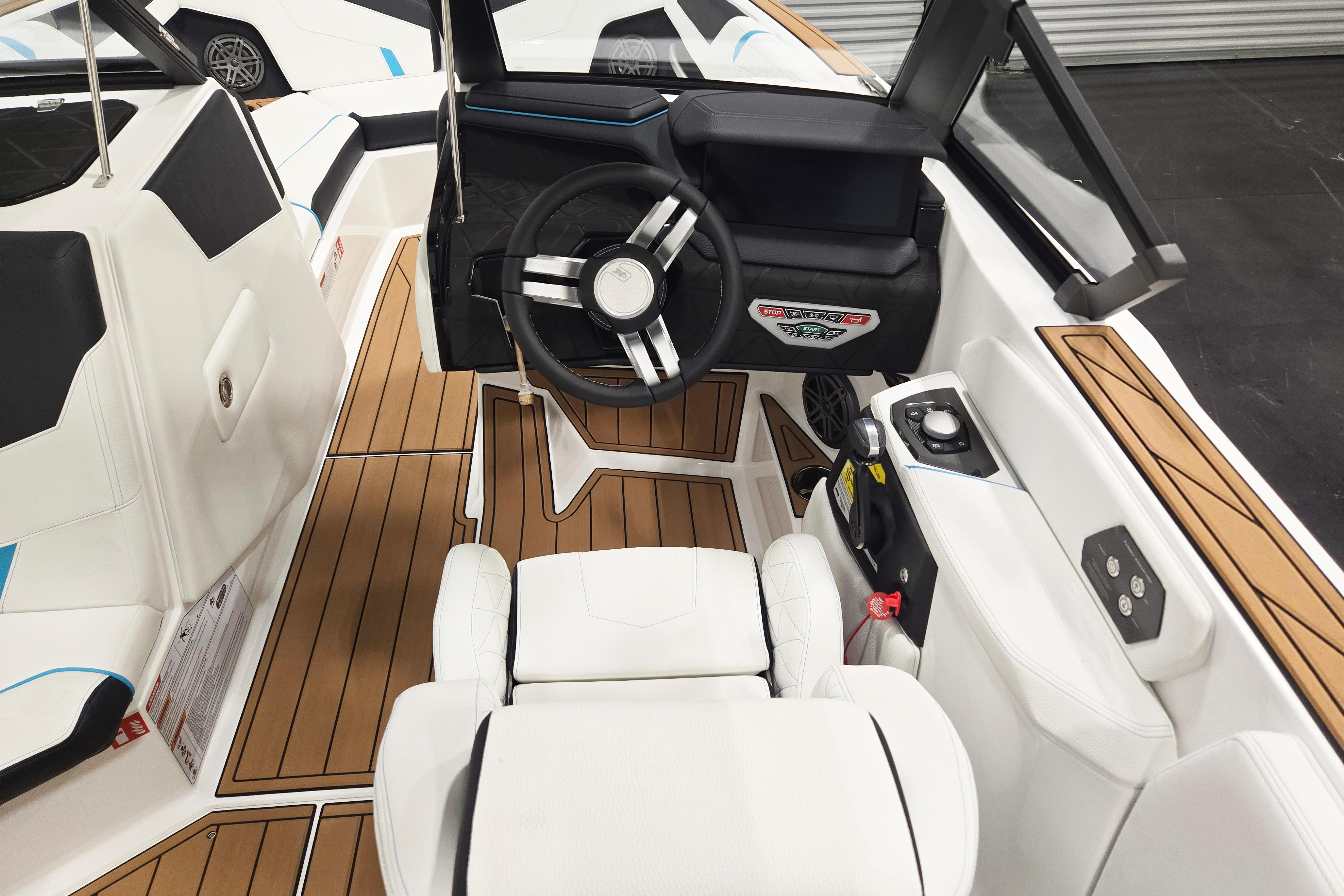 2026 Nautique Super Air Nautique GS22 cockpit with modern steering and luxurious seating.