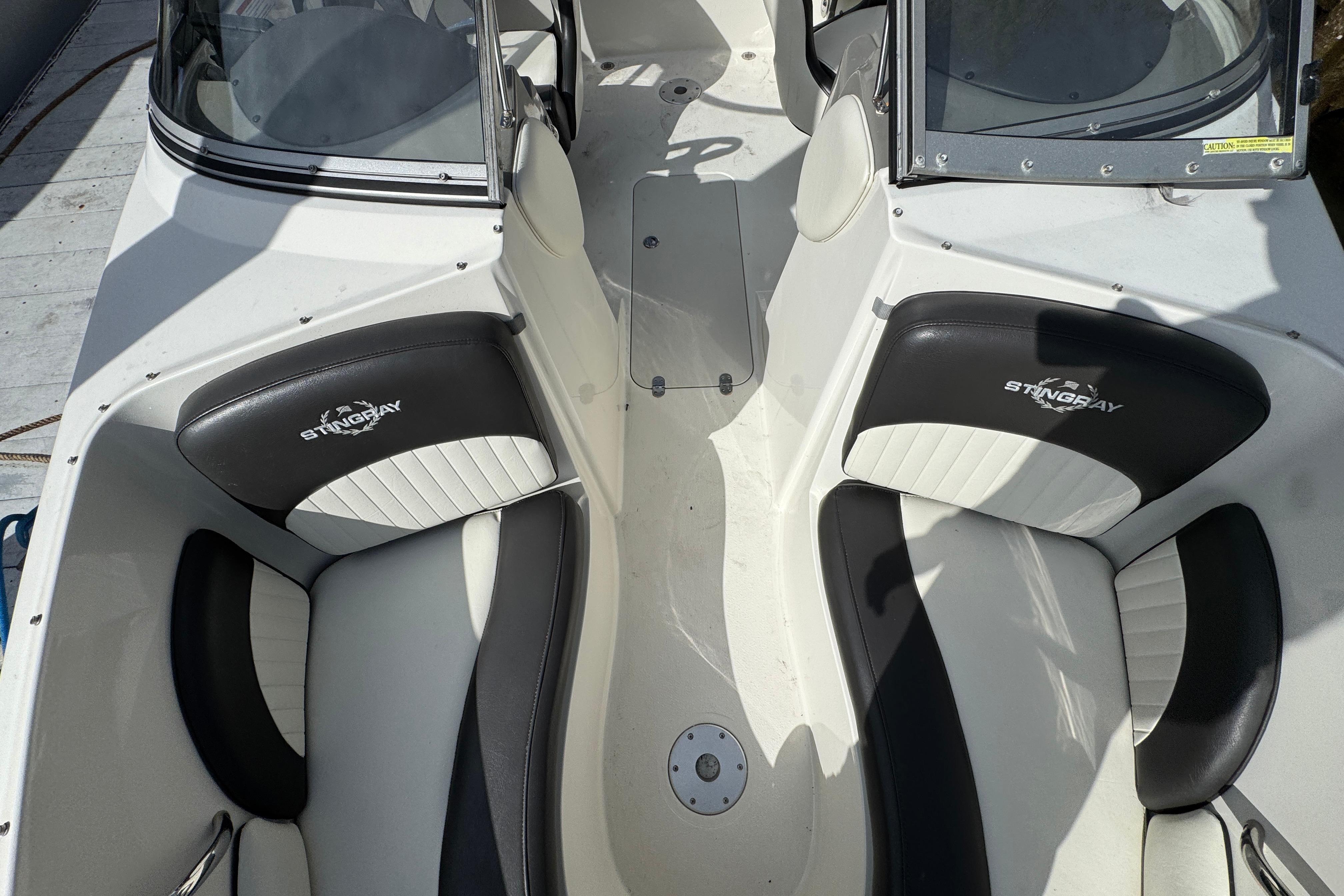 2019 Stingray 204 LR boat interior with black and white seating.