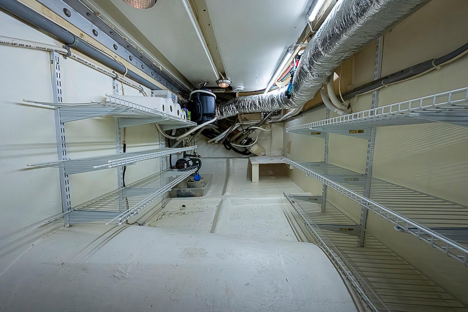 Engine room of 2003 Magna Marine Nova Scotia 47 with shelving and ductwork.