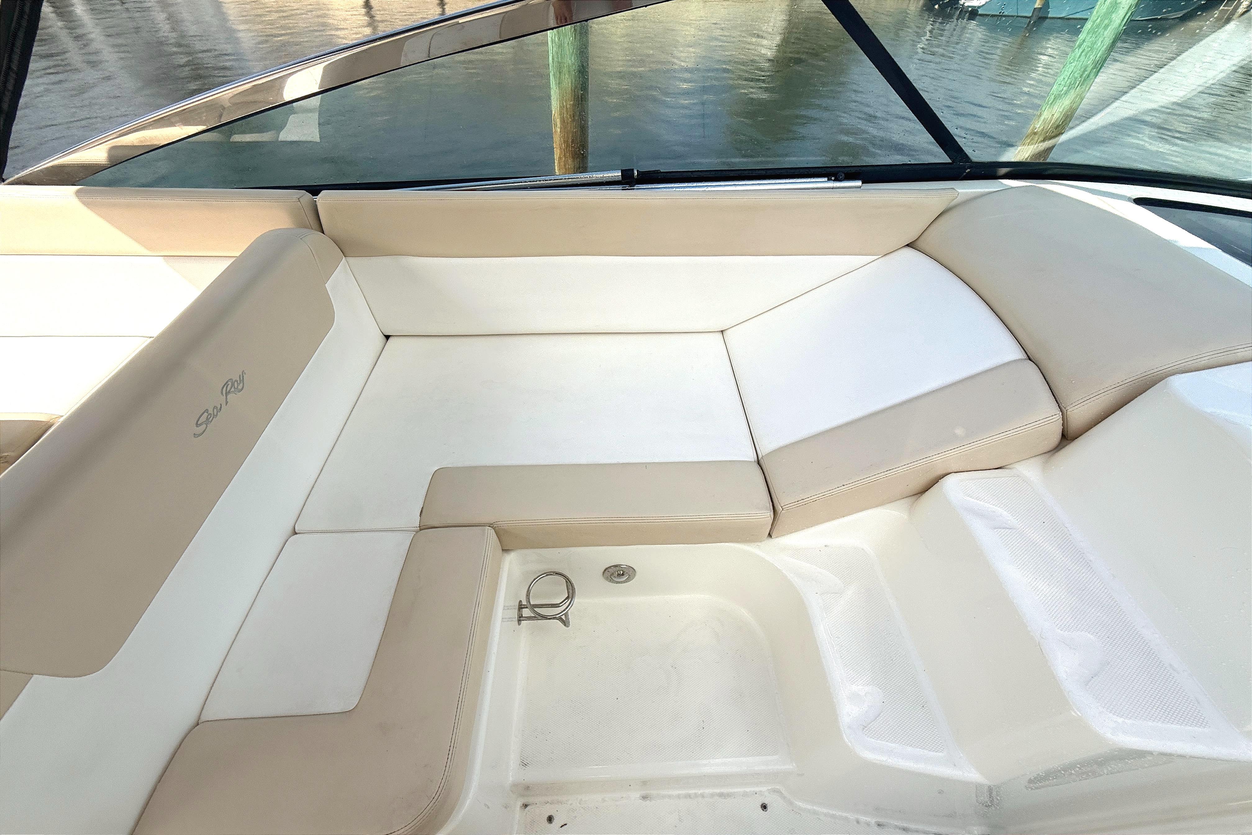 2013 Sea Ray 370 Venture boat interior with beige seating and water view.