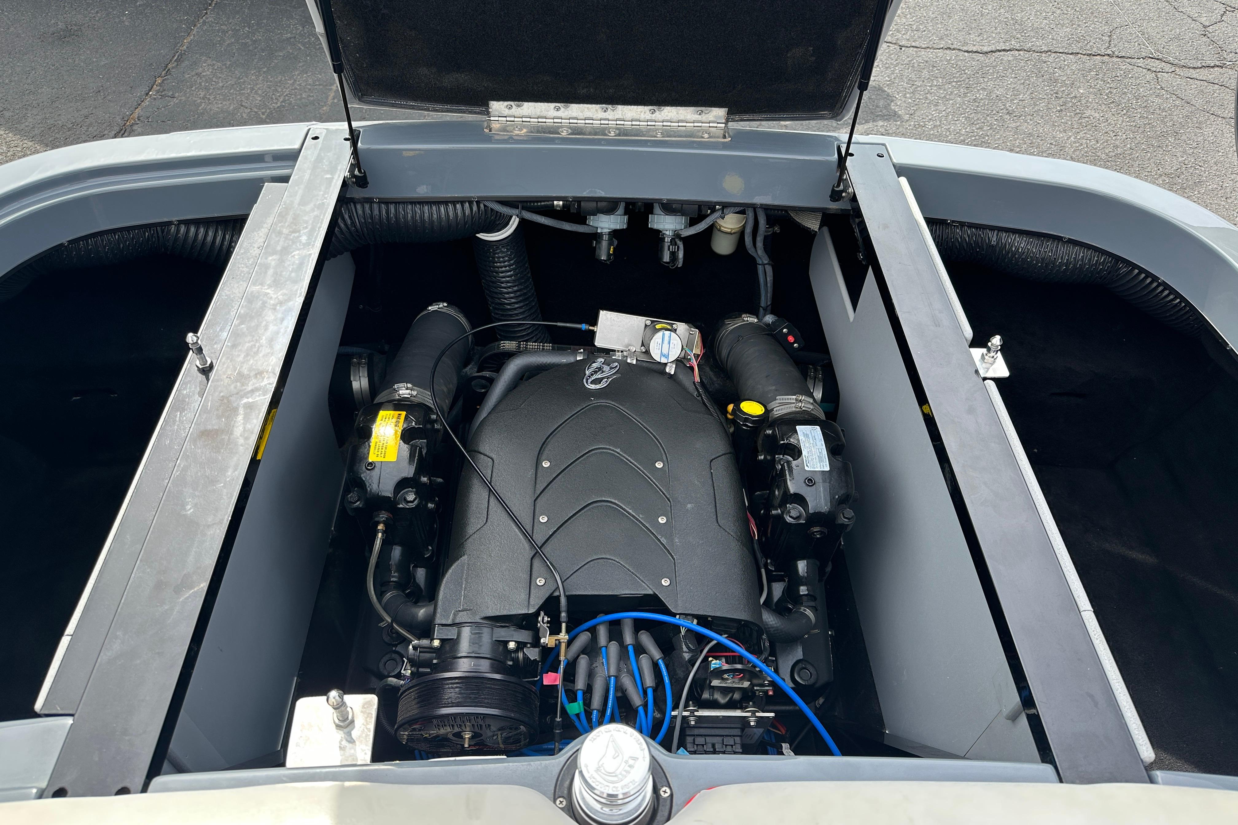 Engine compartment of a 2008 Centurion Enzo SV240 boat, showcasing detailed components.