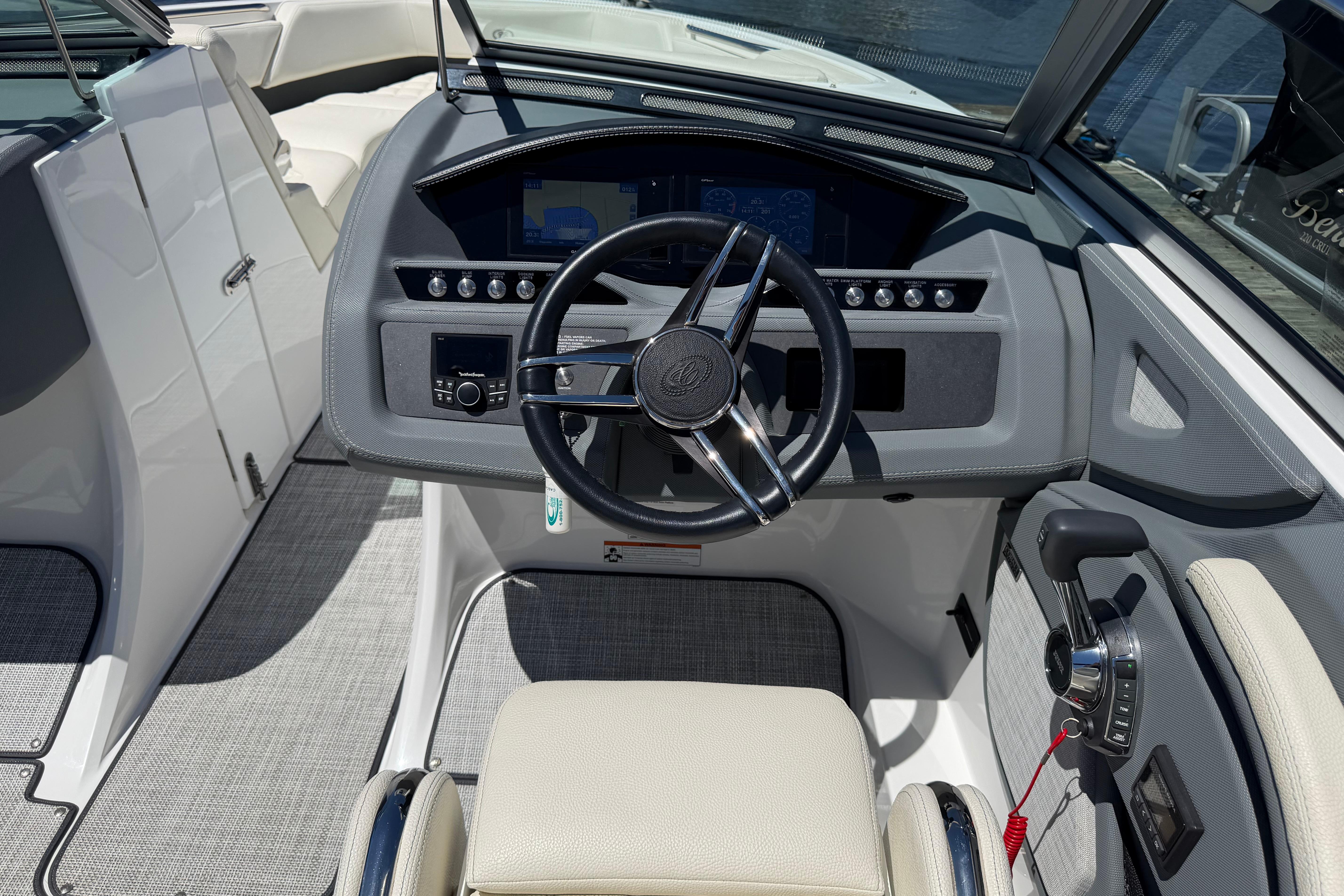 2020 Cobalt R3 boat cockpit with steering wheel and control panel.