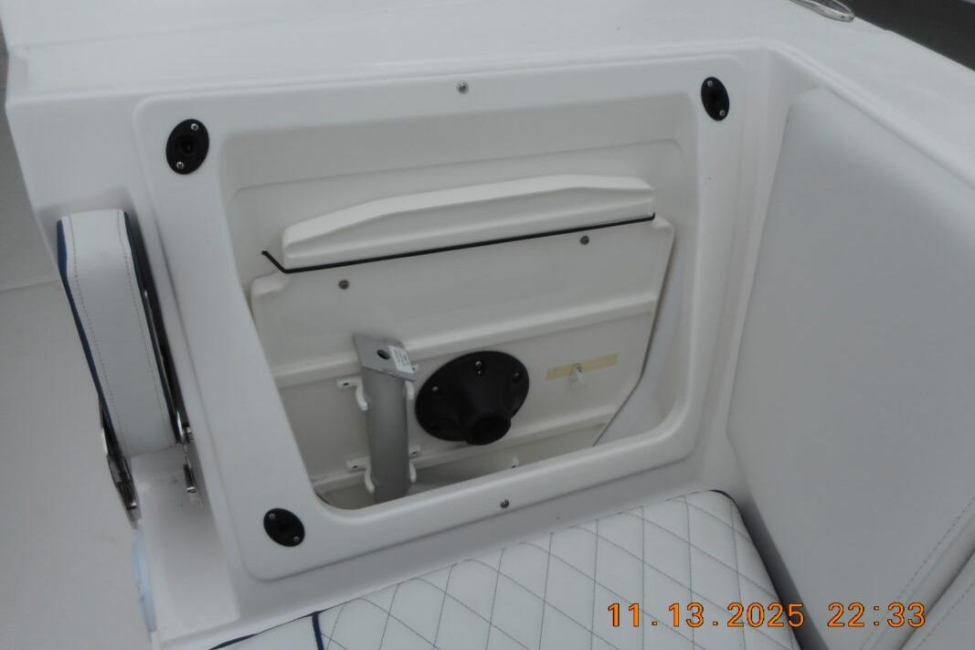 Interior view of 2025 Sea Fox 288 Traveler boat, featuring a storage compartment.
